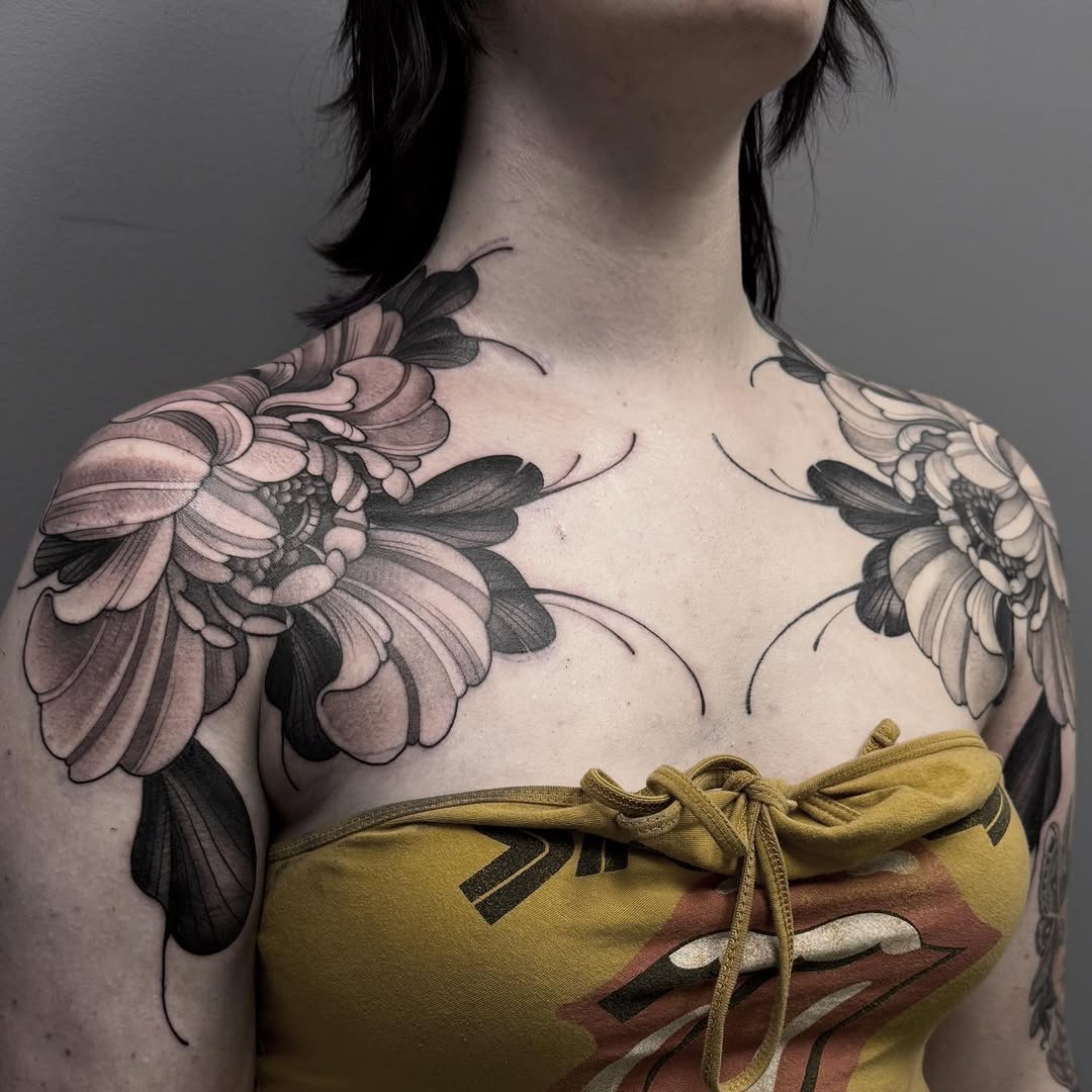 Chrysanthemum flowers dotwork tattoo on the chest by Connie Fiorino - Tattoo Artist