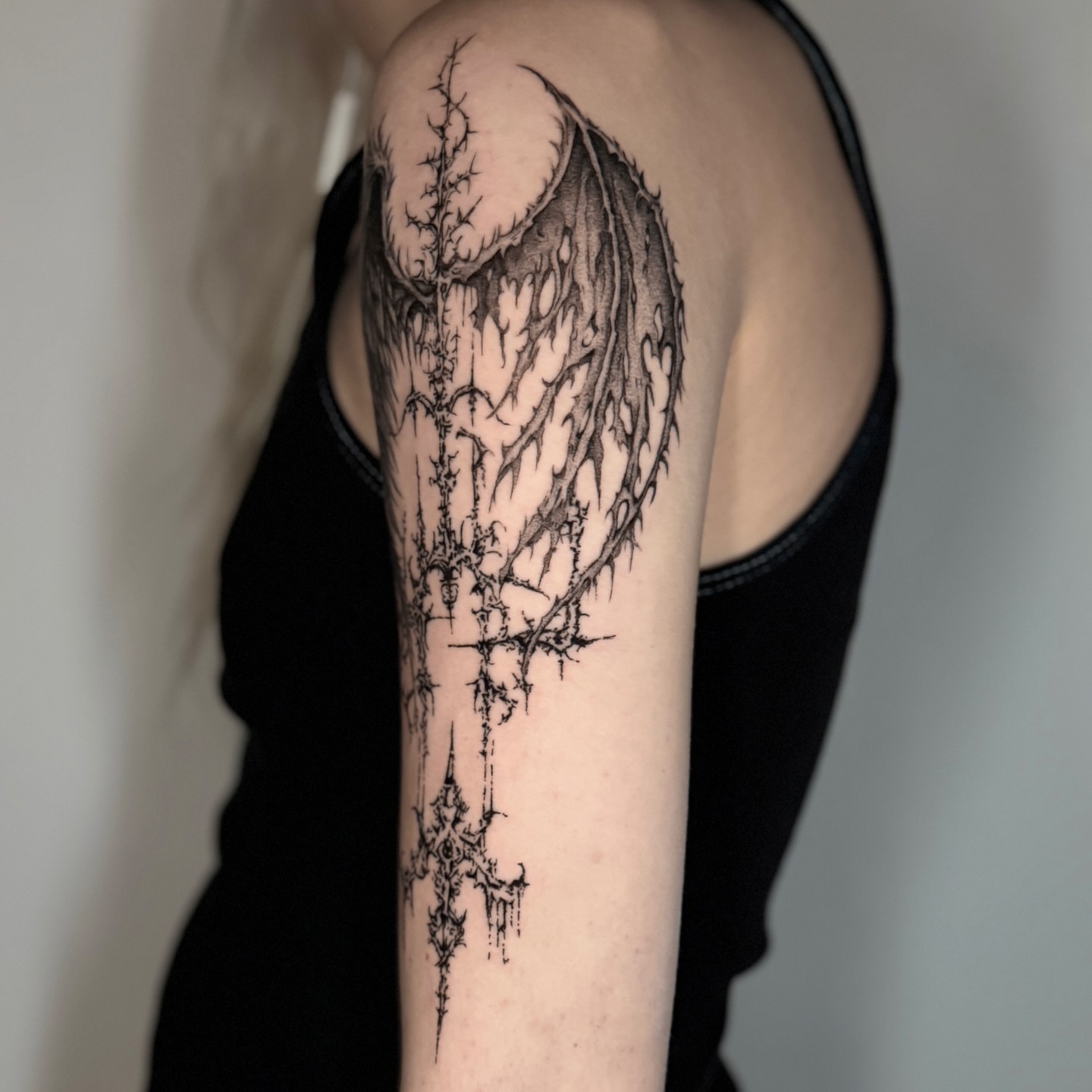 Thorned cross dark realism tattoo on the forearm by Cybersigilism & Fineline Blackwork
