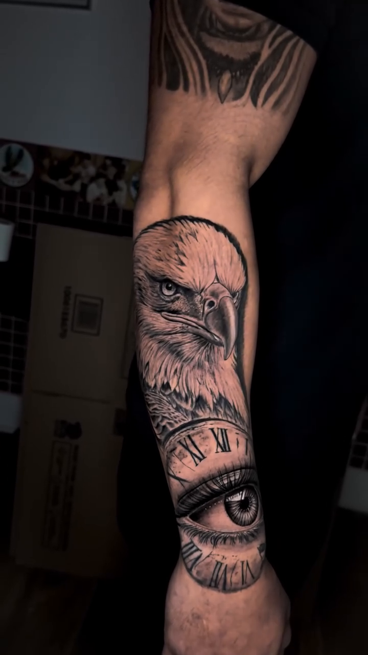 Eagle and eye with clock realism tattoo by Tiago Britto