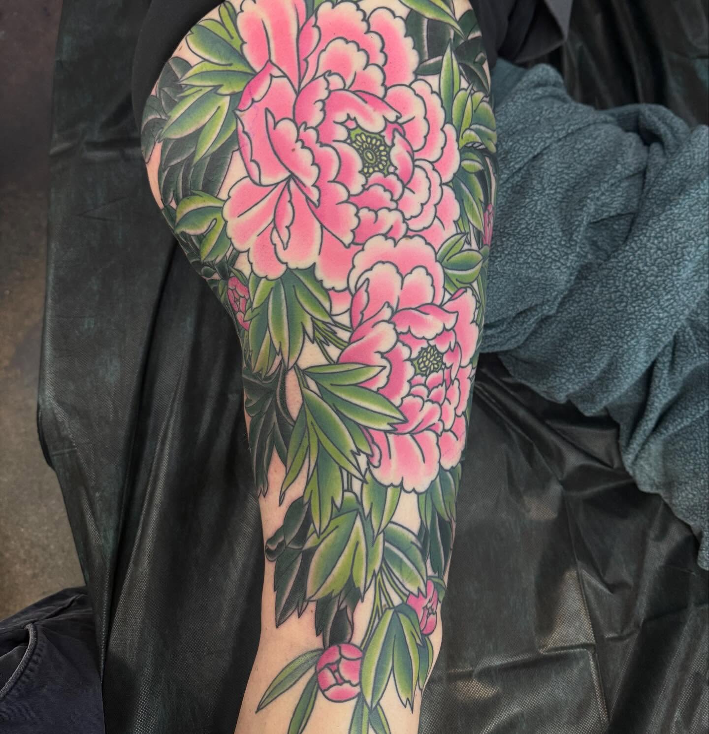 Peony flowers American traditional tattoo on the forearm by Mike Diamond