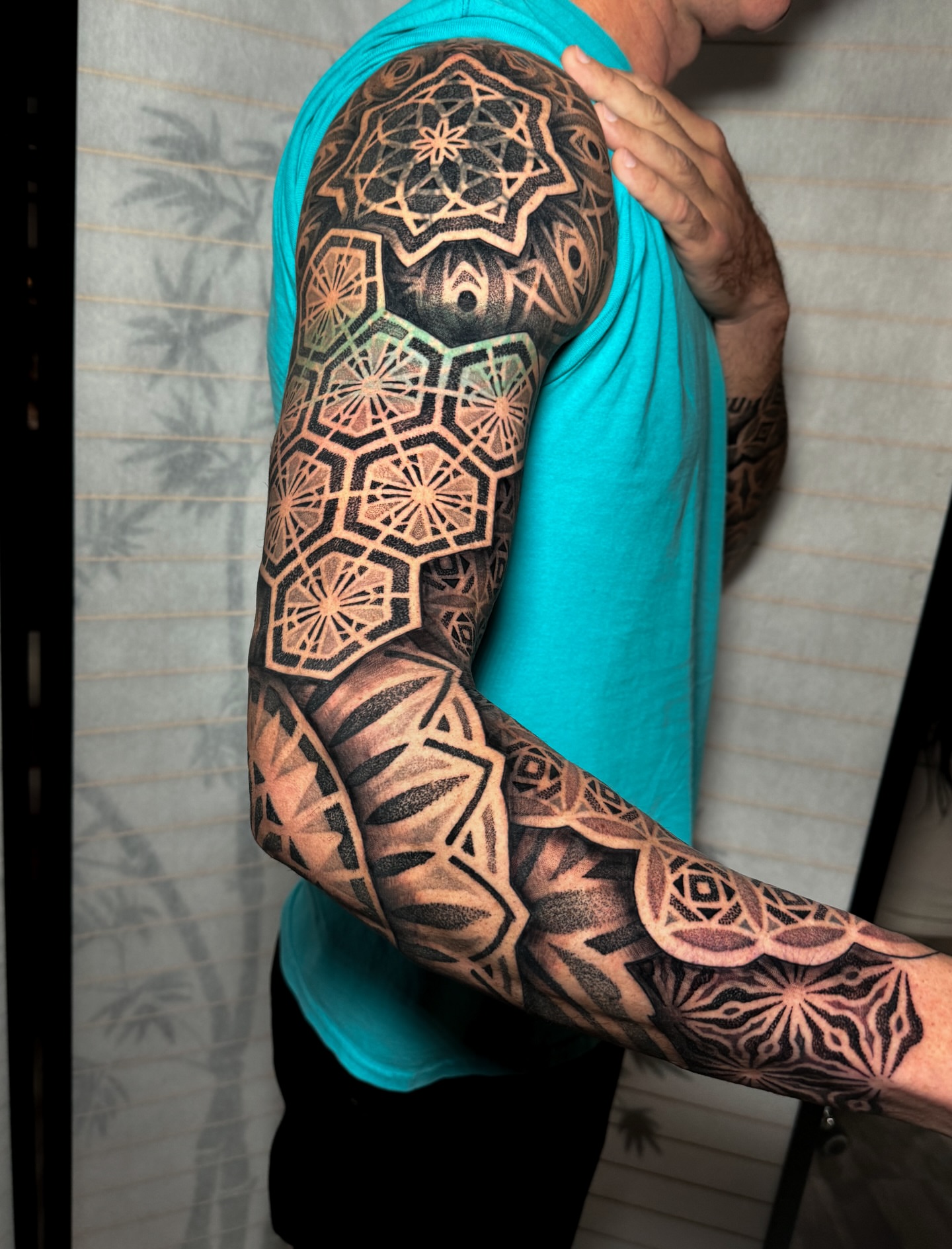 Geometric patterns geometric tattoo on the upper arm by Carrie