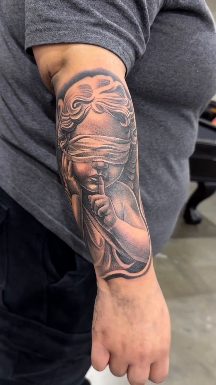 Blindfolded woman realism tattoo by Isaac Barrientos