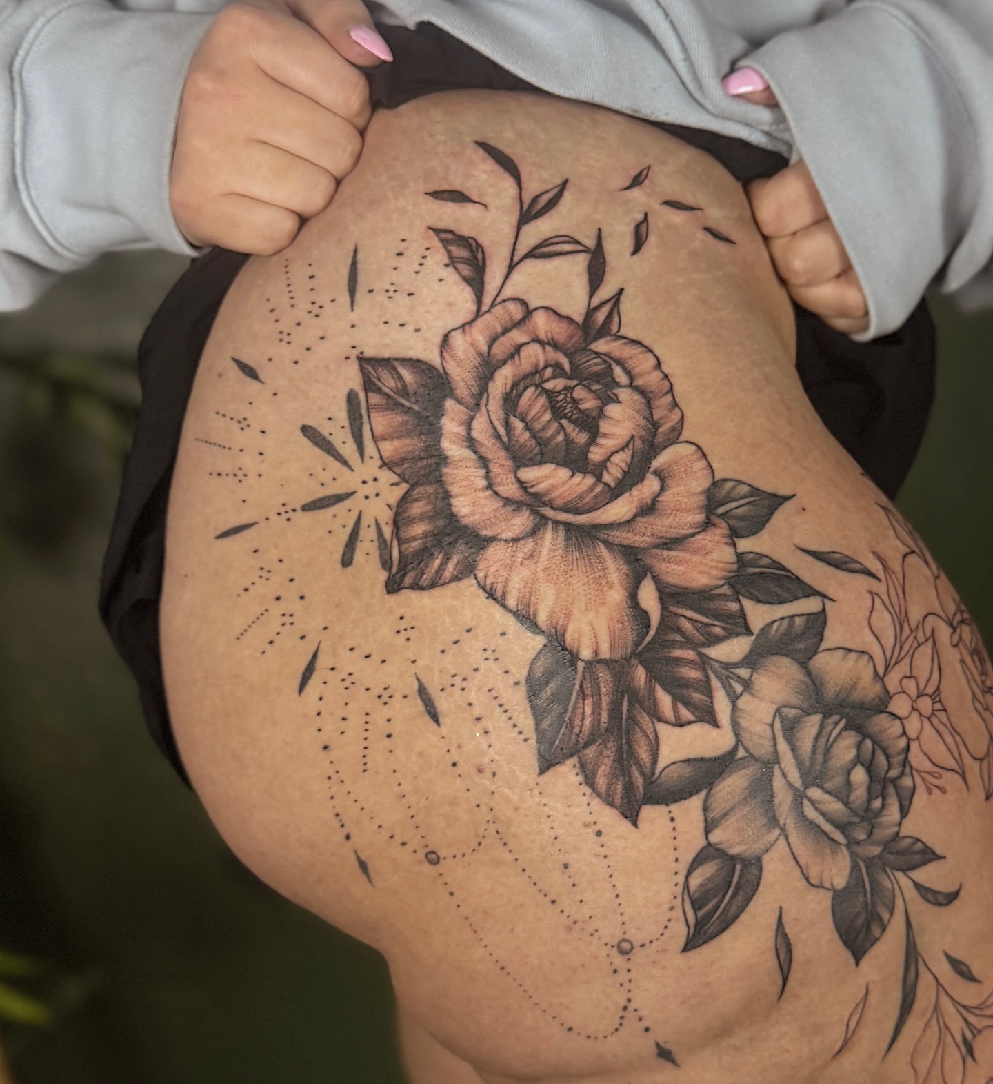 Roses dotwork tattoo on the thigh by Breanna Werner
