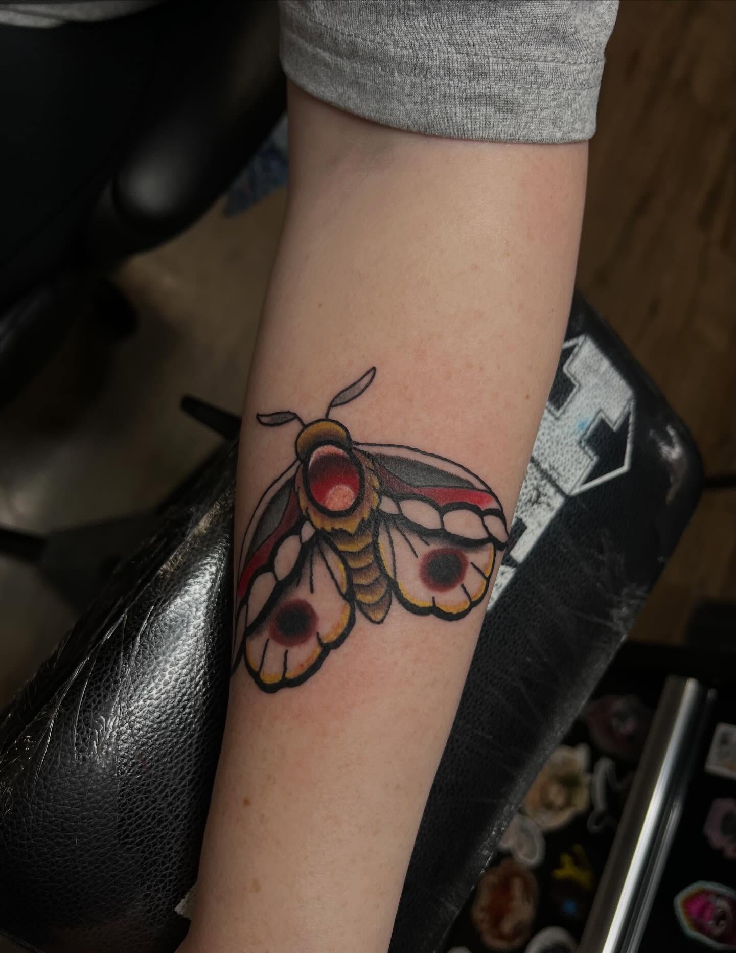 Moth American traditional tattoo on the forearm by Ellari
