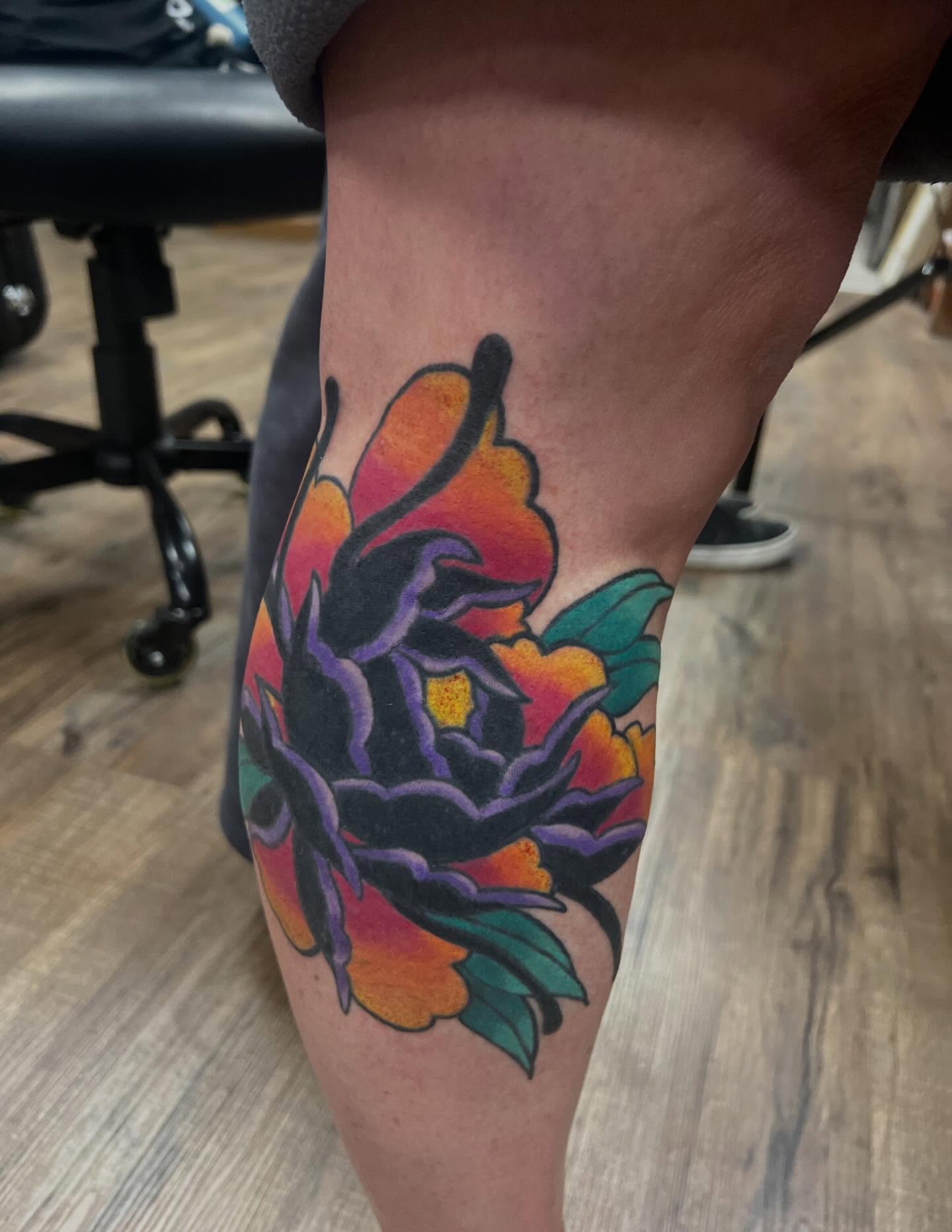 Flower American traditional tattoo on the thigh by Ellari