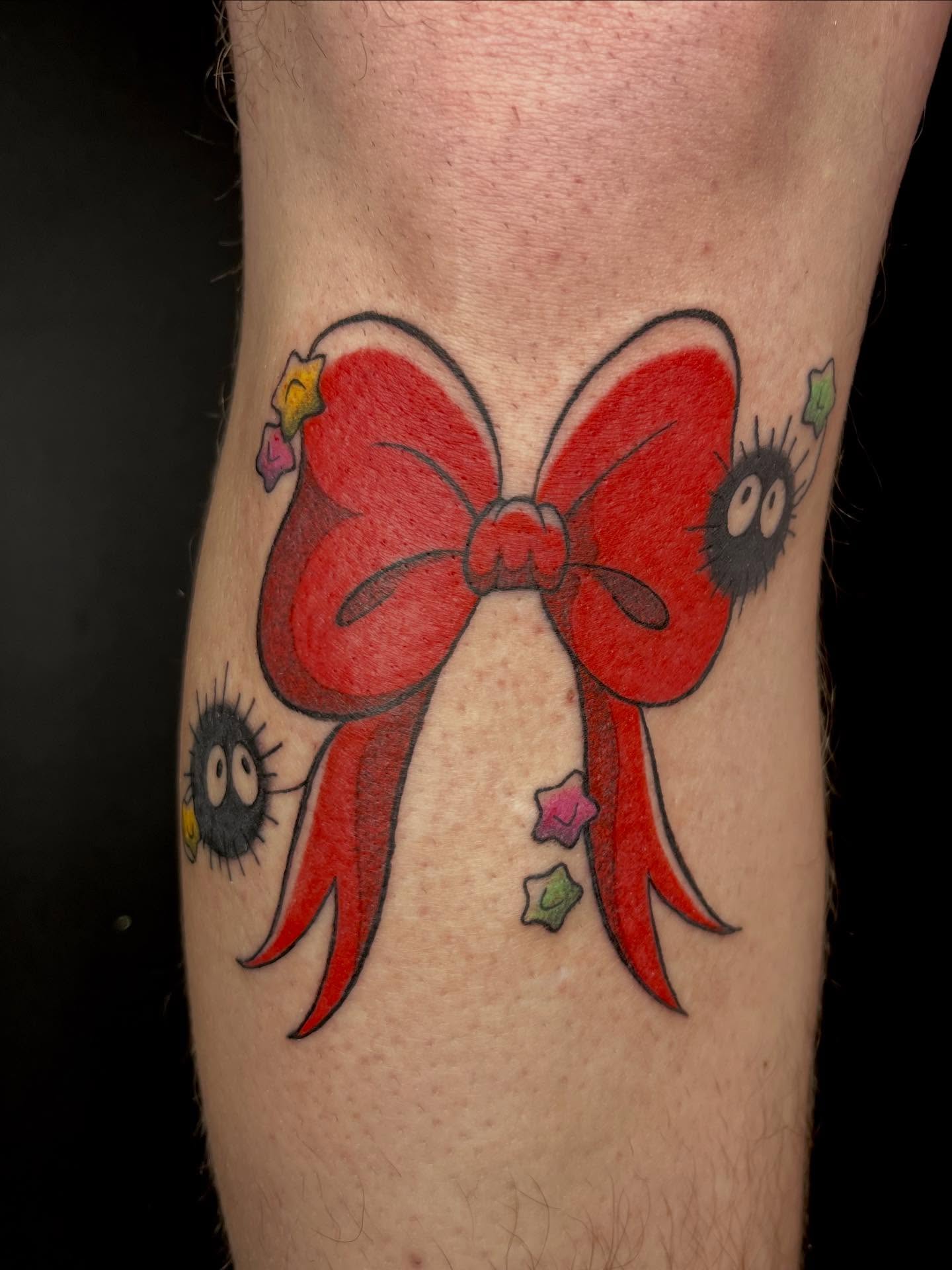 Red bow new school tattoo on the forearm by Chase Healey, Salt Lake City, Utah