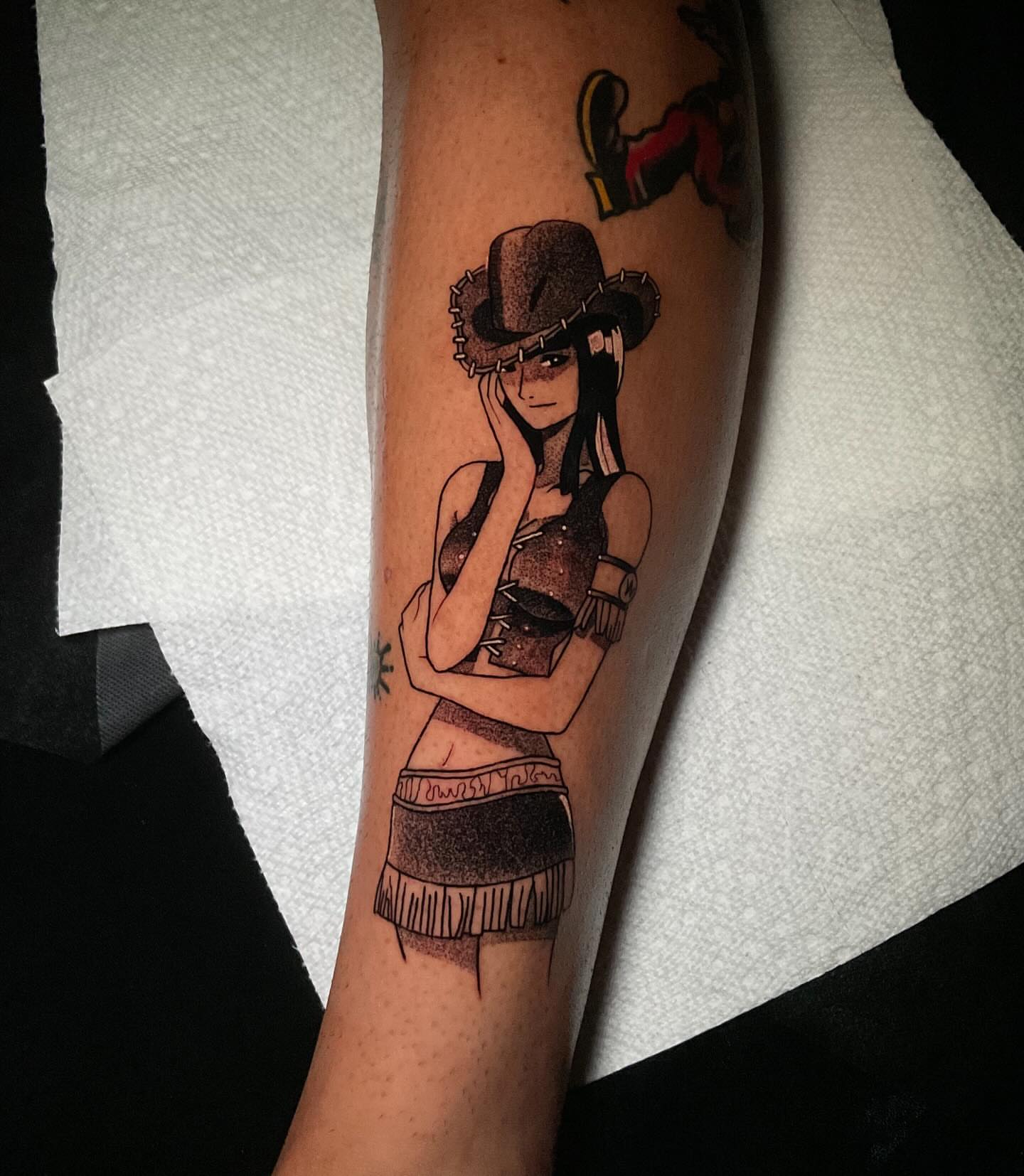 Cowgirl black and grey tattoo on the forearm by Kenneth Ruiz