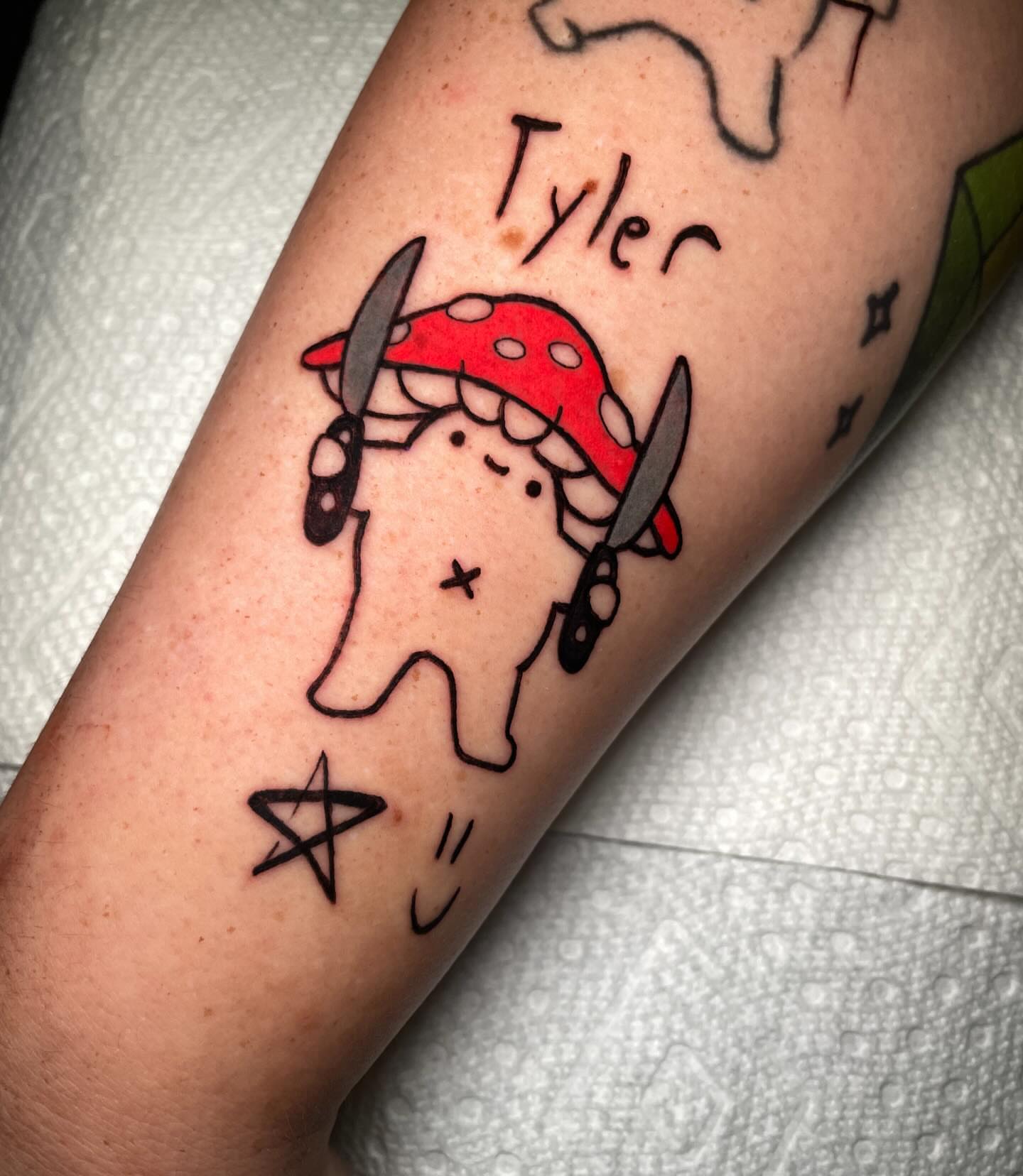 Tooth with mushroom hat dotwork tattoo on the forearm by Kenneth Ruiz