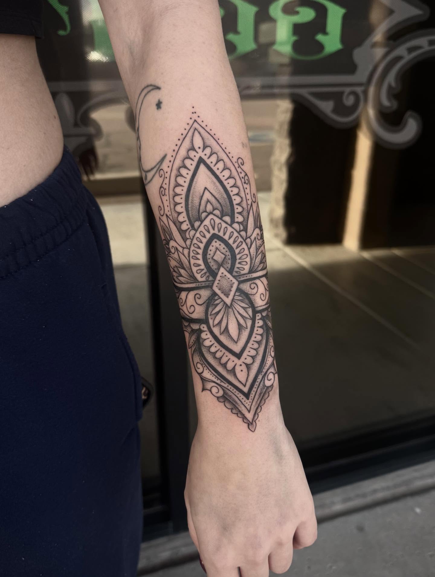 Mandala ornamental tattoo on the forearm by Jianna
