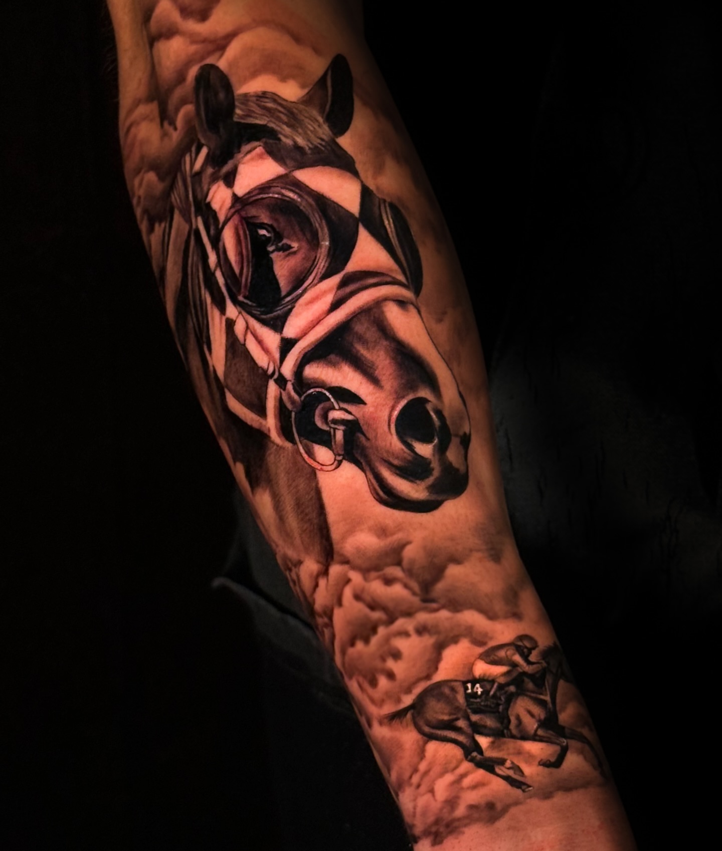 Horse and jockey realism tattoo on the forearm by Iryna Polyakhova