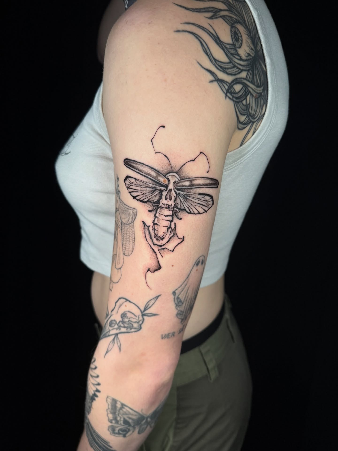 Moth with skull black and grey tattoo on the forearm by z o y a, Seattle, Washington