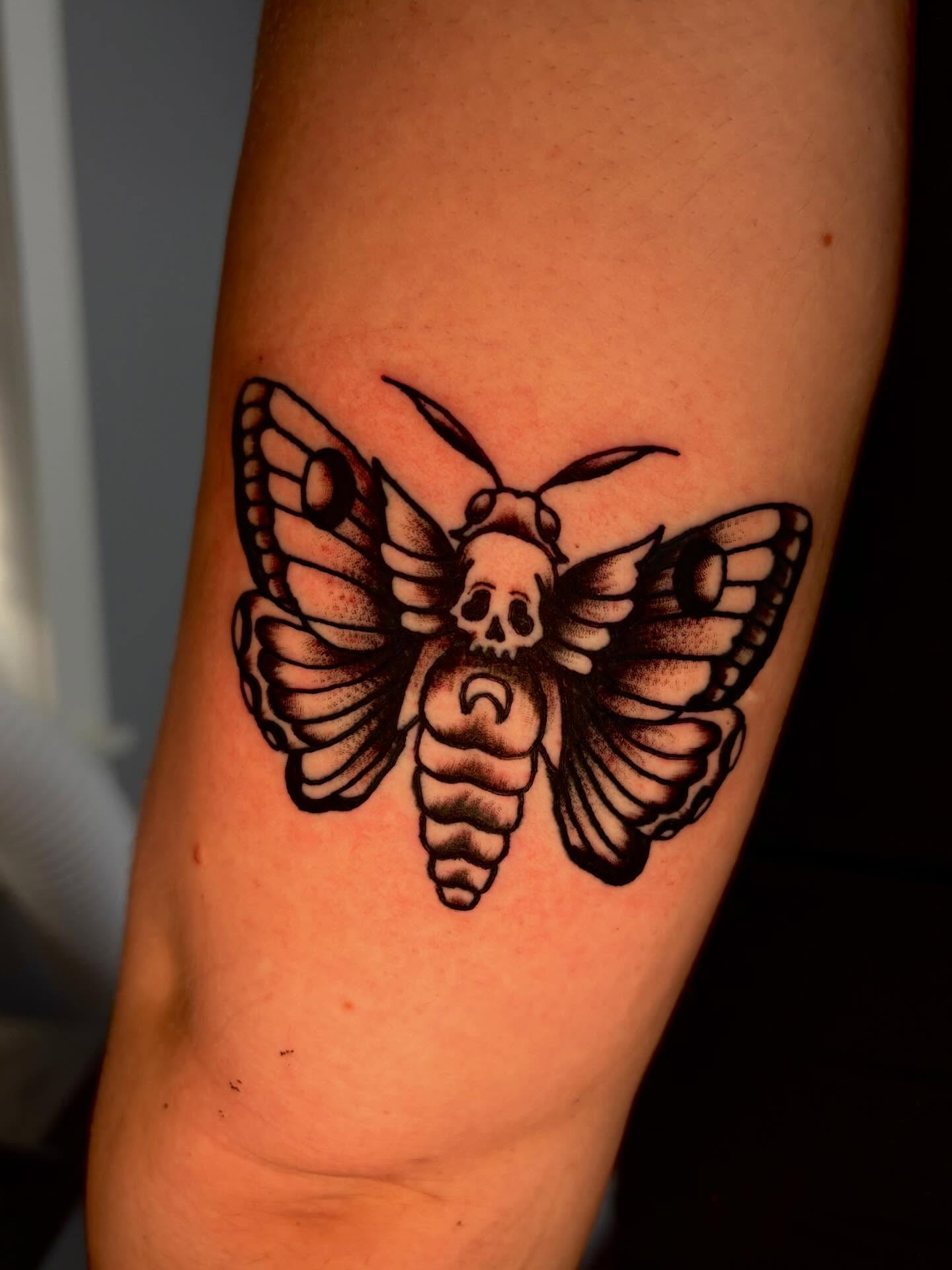 Death moth dotwork tattoo on the forearm by Jenna Clayton