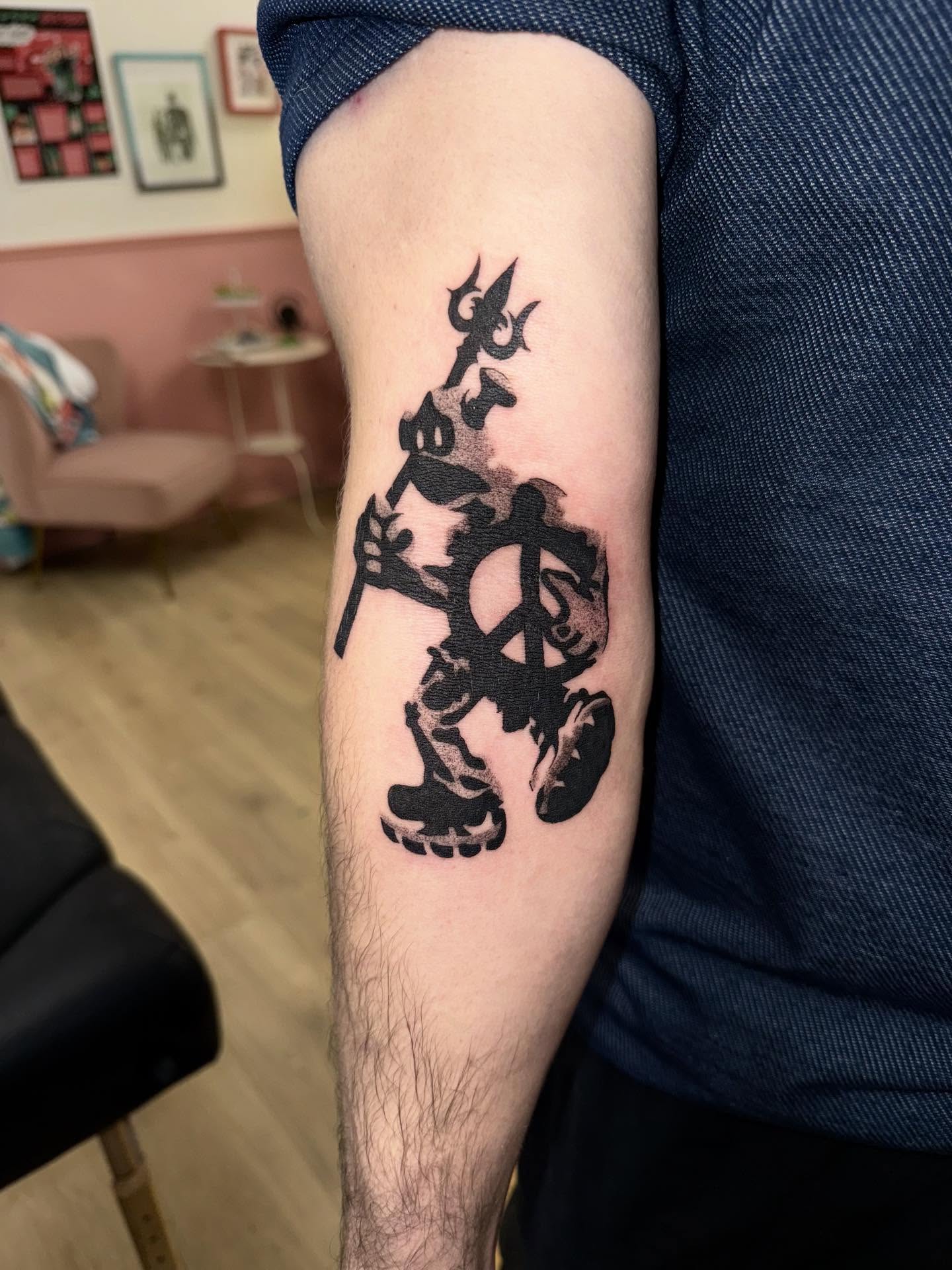Minnie mouse black and grey tattoo on the forearm by Laurito