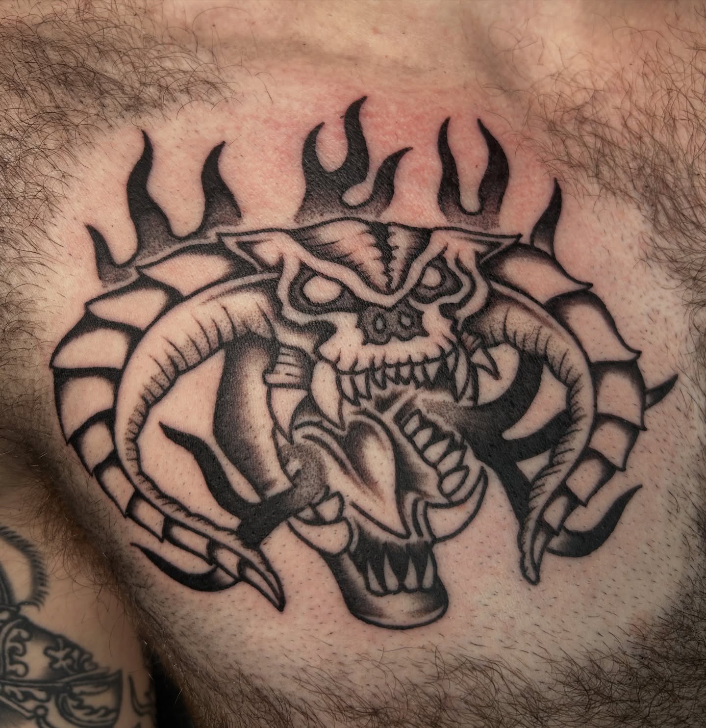 Demon skull dark realism tattoo on the chest by Dylan James