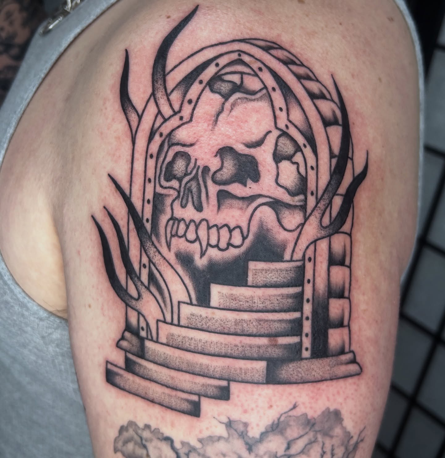 Skull and stairs geometric tattoo on the thigh by Dylan James