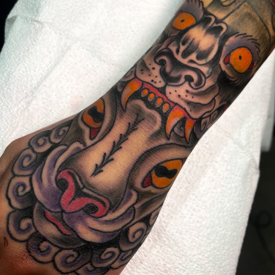 Ogre mask American traditional tattoo on the forearm by Sky G, Colorado Springs, Colorado