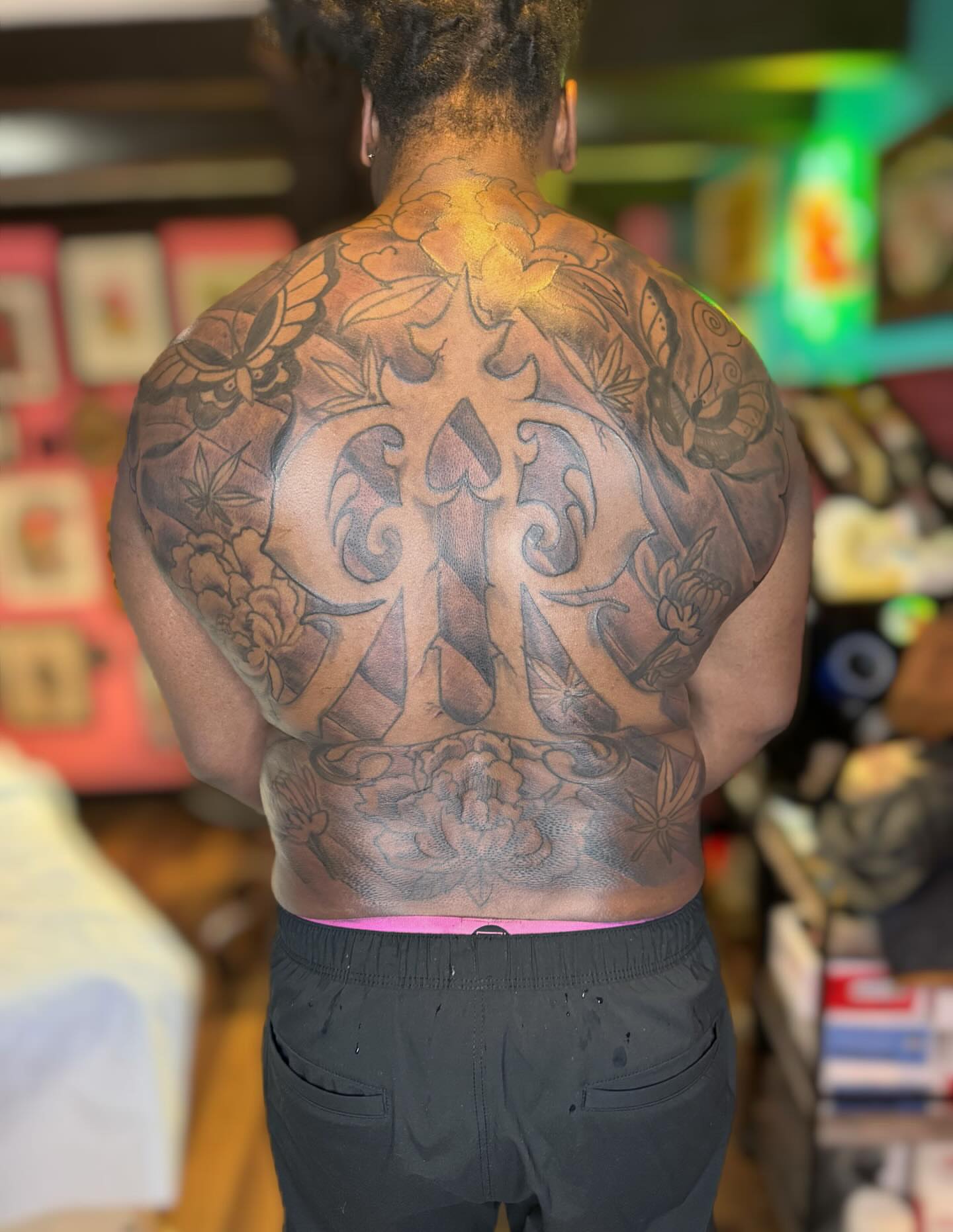 Spine piece American traditional tattoo on the back by @brocks_tatt_attic_, New Orleans, Louisiana