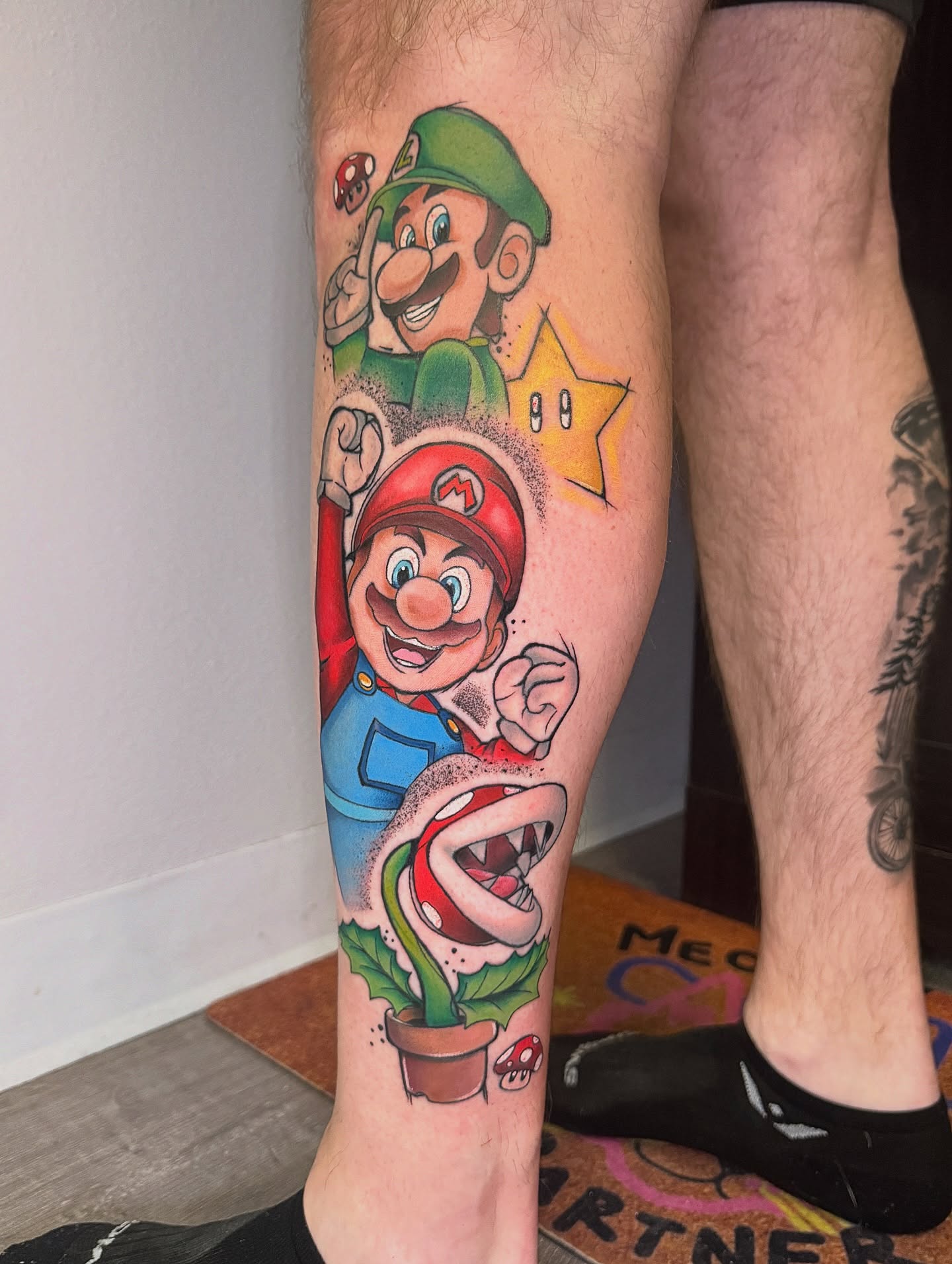 Super Mario characters American traditional tattoo on the calf by Murbee