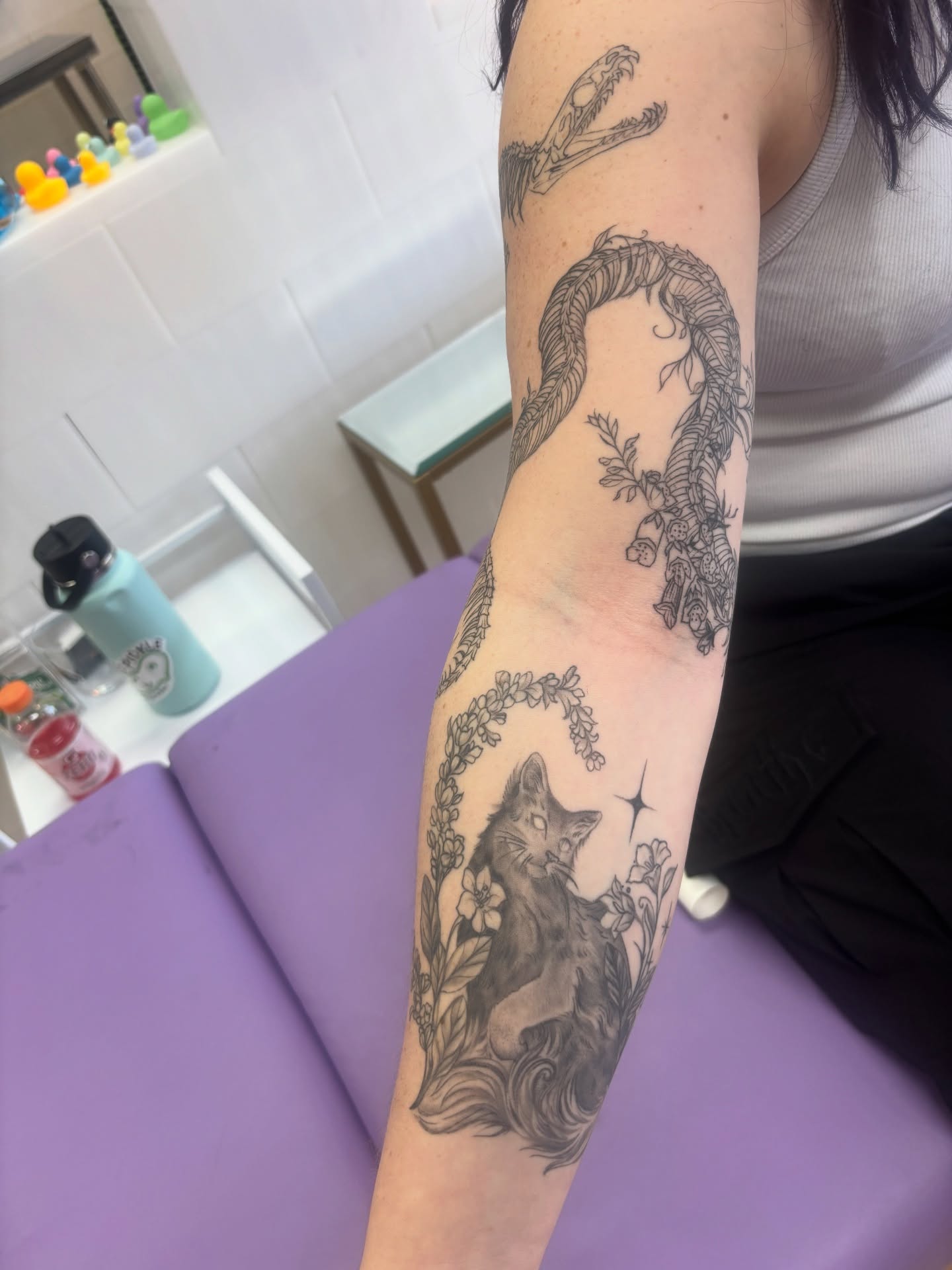 Fox and snake realism tattoo on the forearm by Ivanna