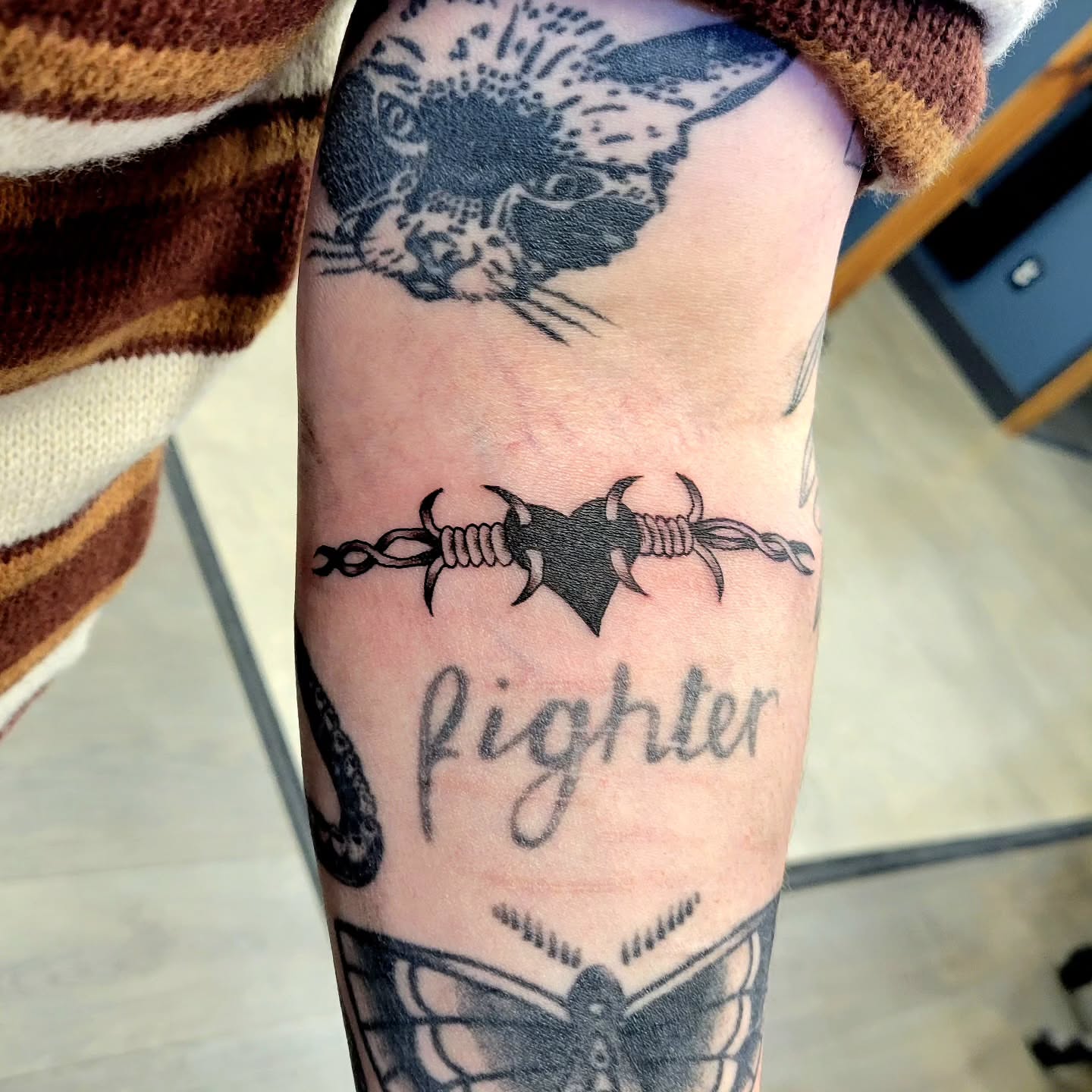 Barbed wire heart black and grey tattoo on the forearm by Kyle - Portland Oregon Tattoo Artist