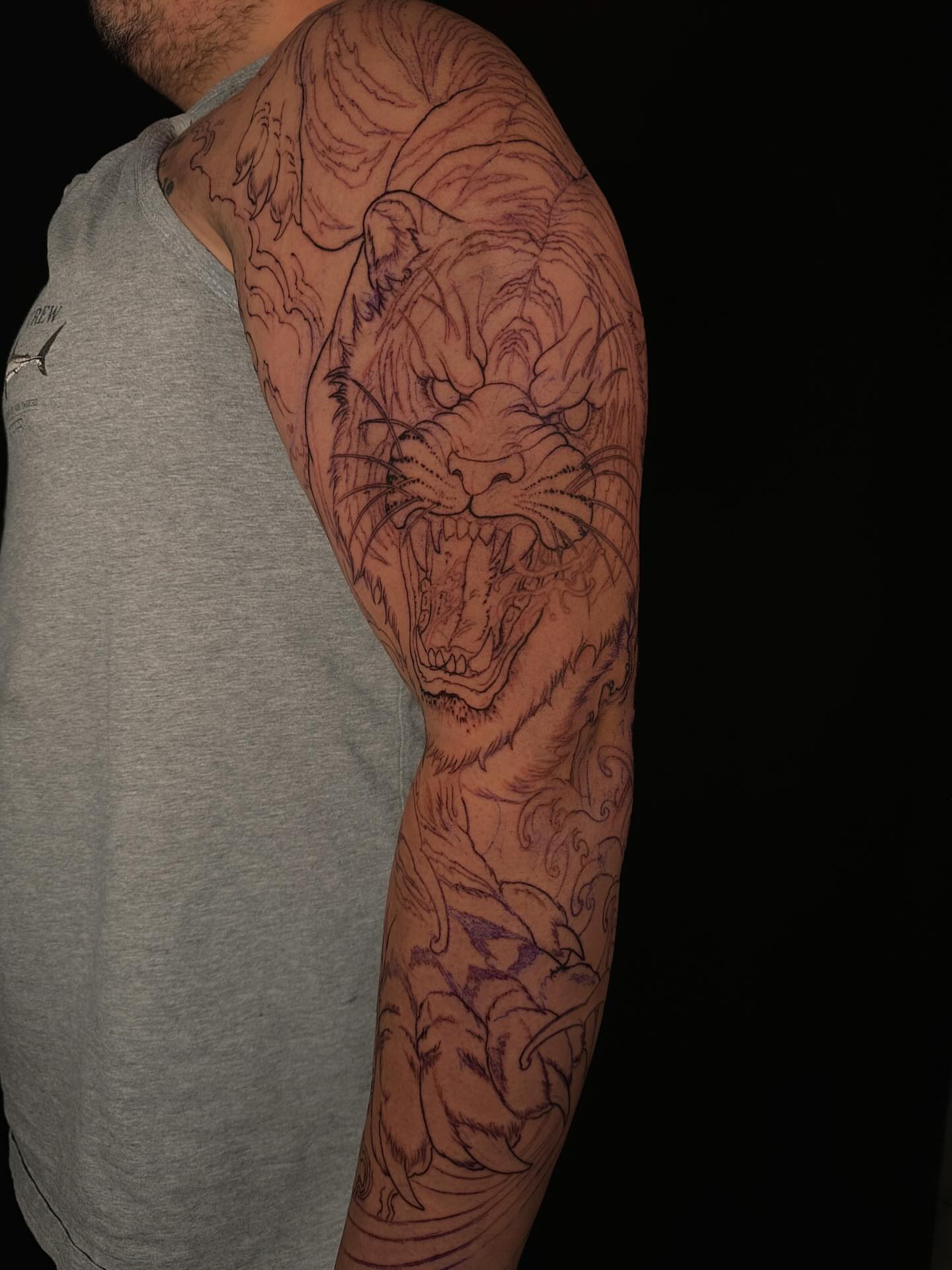 Lion japanese irezumi tattoo on the upper arm by Vince Lau