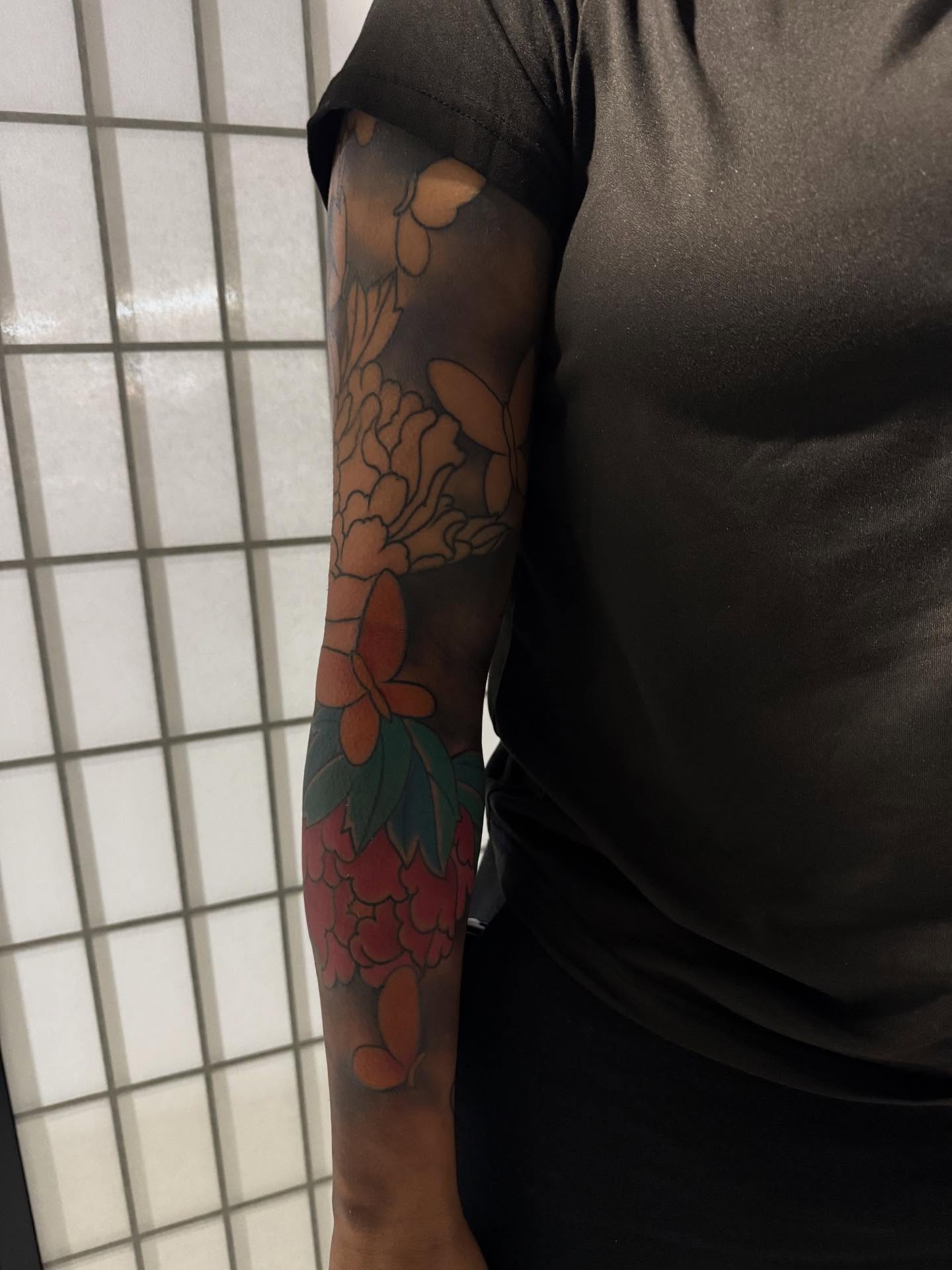 Floral arrangement American traditional tattoo on the forearm by Randall Croley El