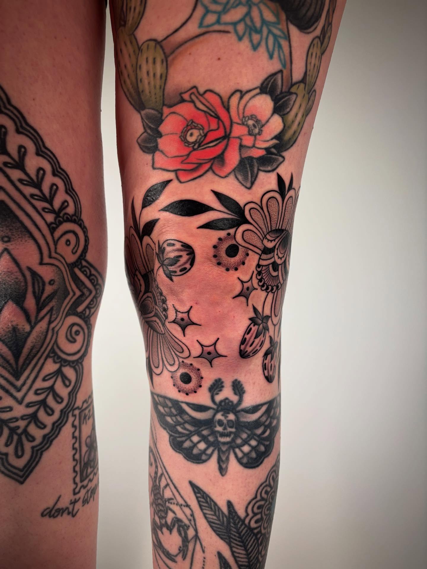Floral and insect motifs American traditional tattoo on the forearm by Victoria Bacon
