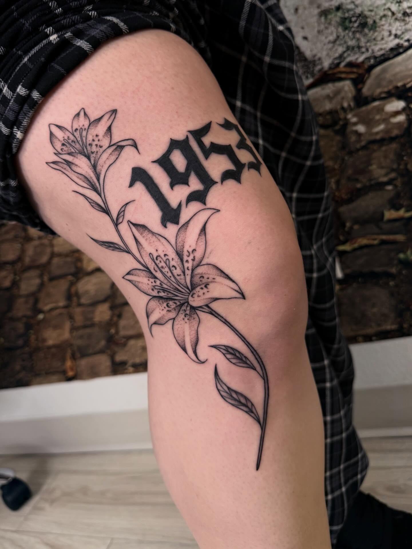 Lily and script black and grey tattoo on the forearm by Nadia ★