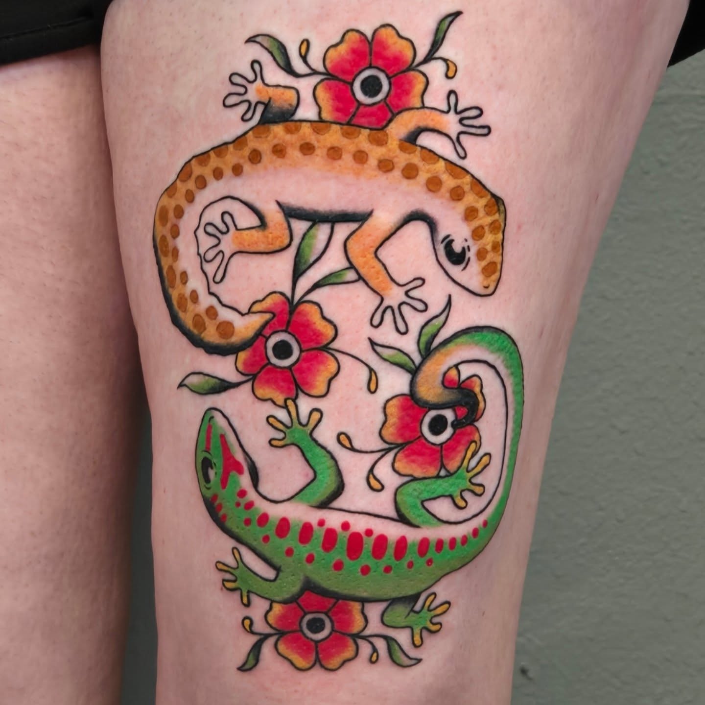 Geckos and flowers dotwork tattoo on the thigh by alec