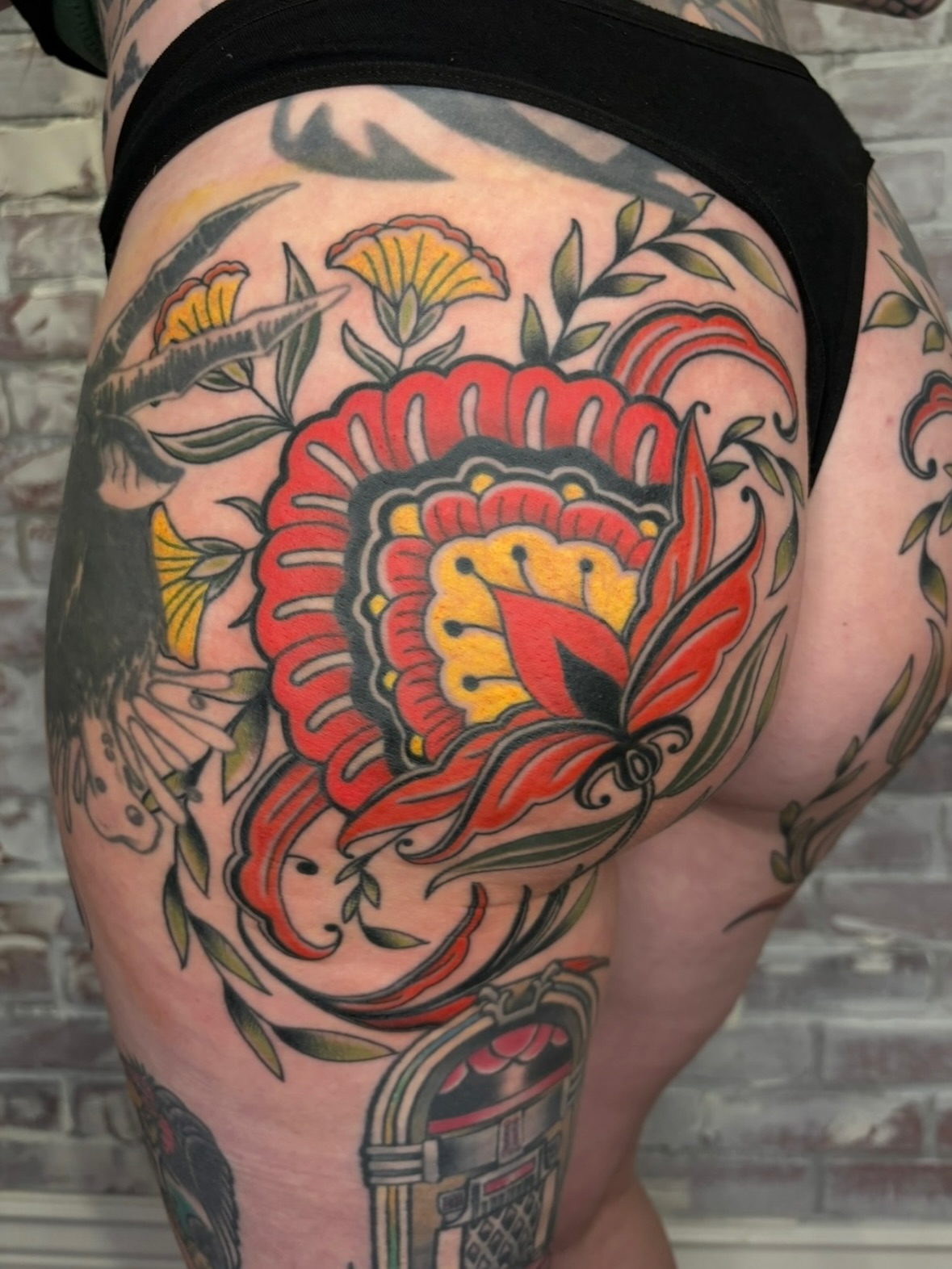 Floral bouquet American traditional tattoo on the thigh by π―πππππ