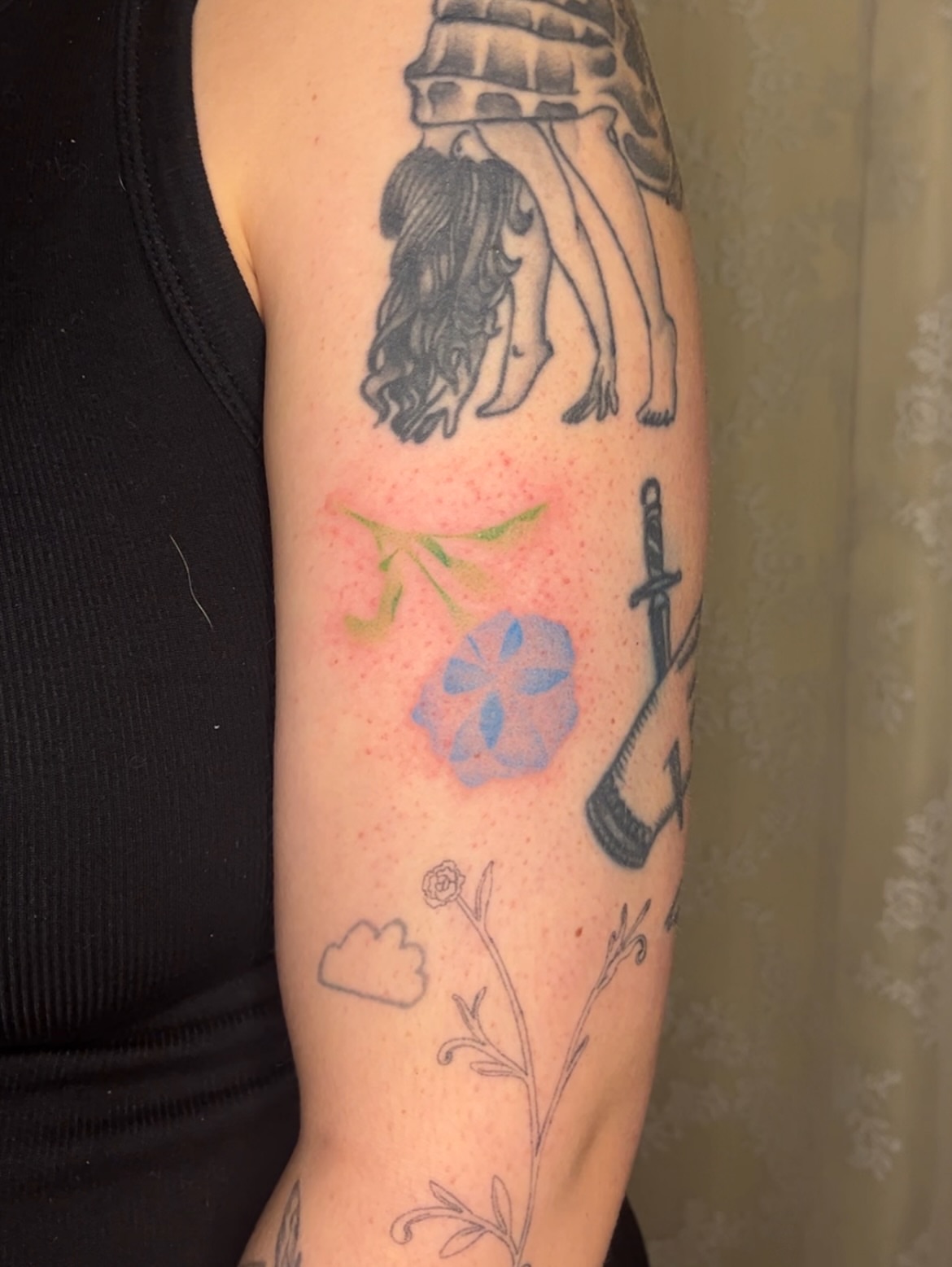 Flower and sword dotwork tattoo on the forearm by mia