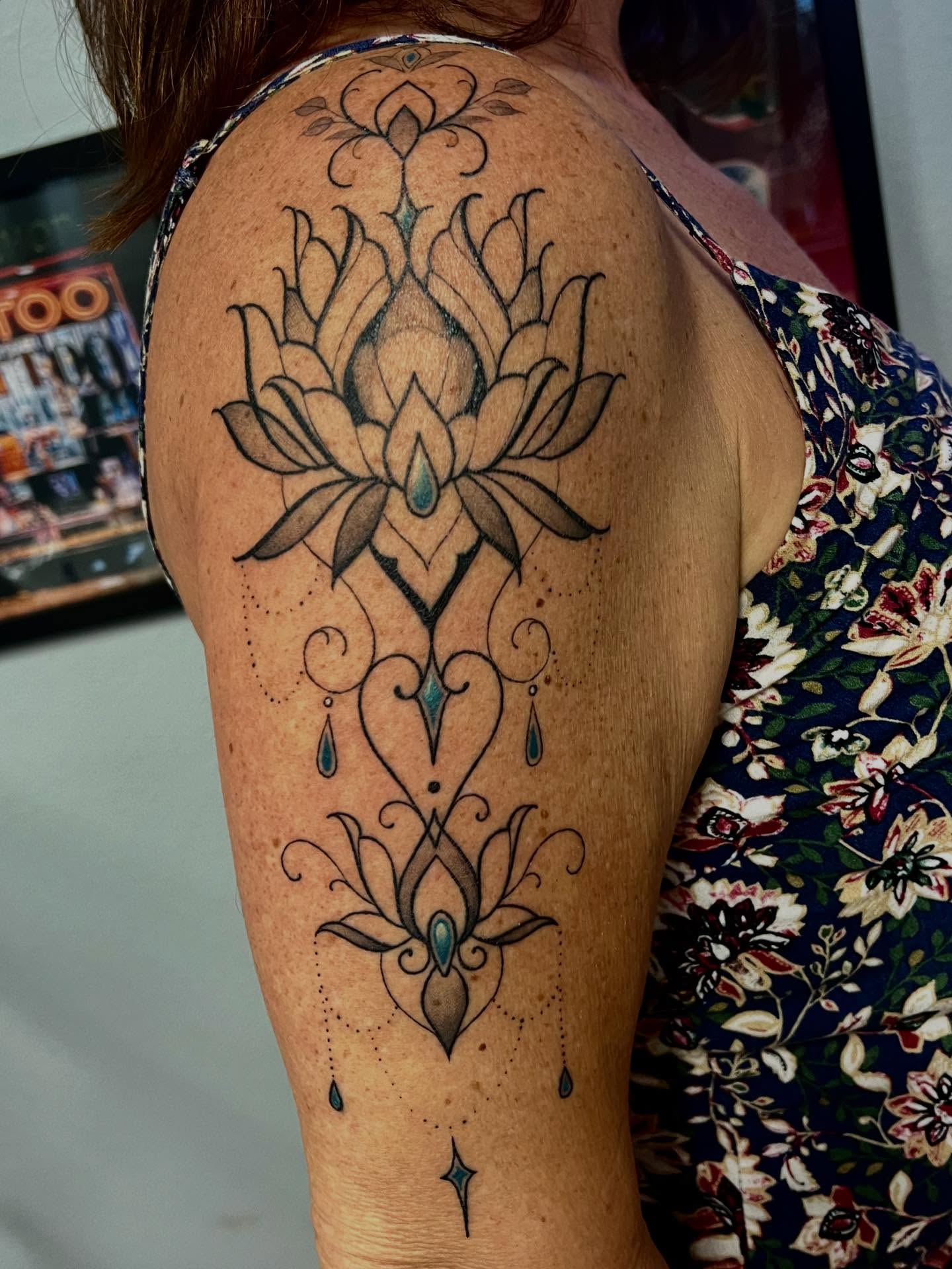 Lotus flower dotwork tattoo on the shoulder by Joi Bailey, Denton, Texas