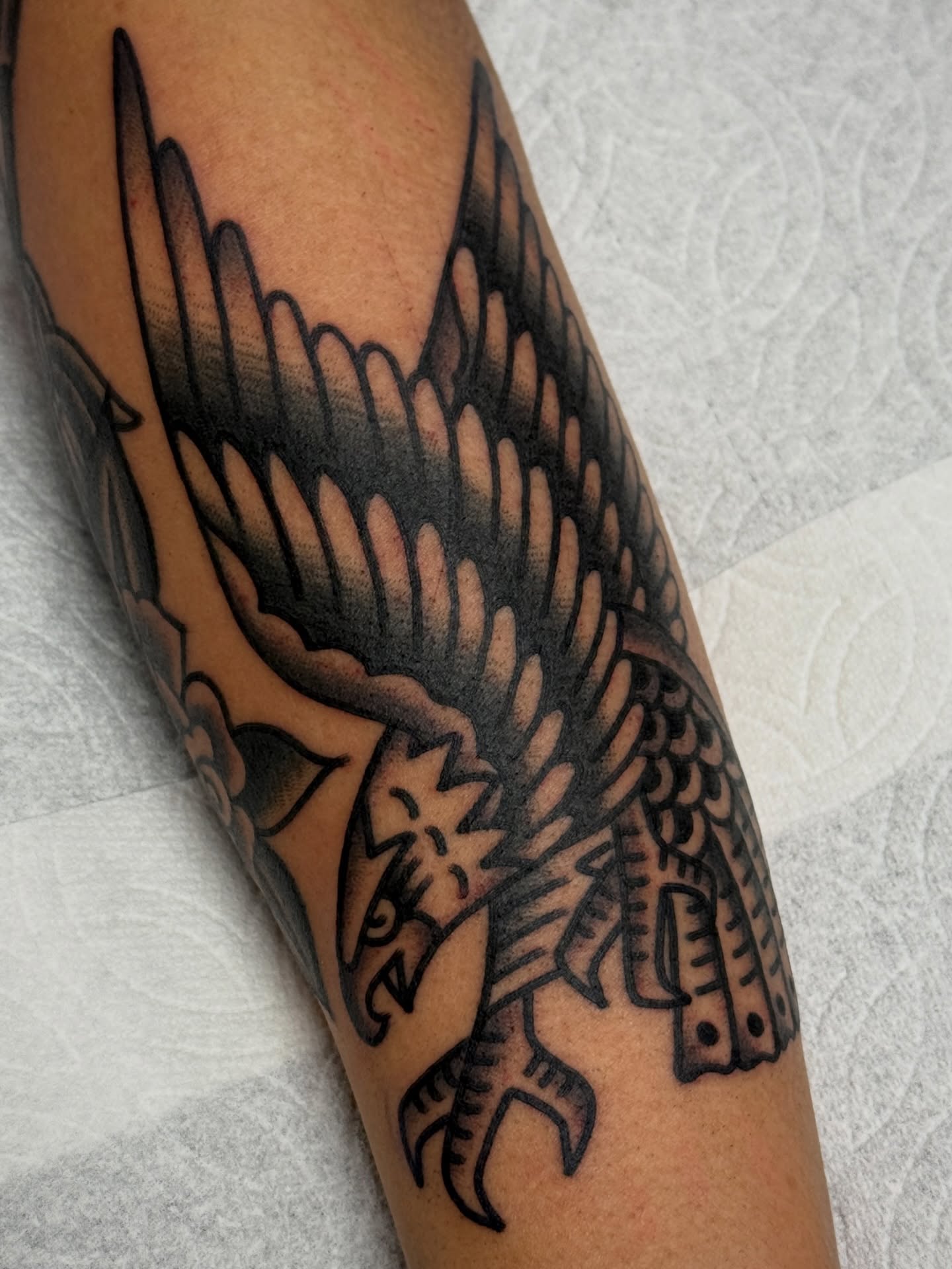Swallow American traditional tattoo on the forearm by Jordan Allen