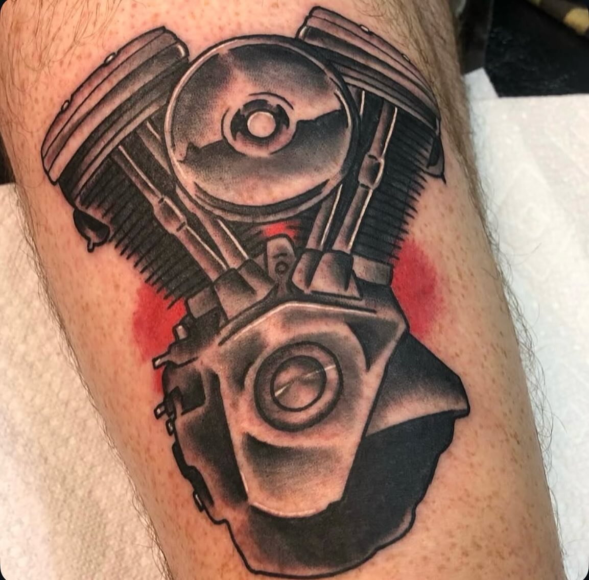 Engine black and grey tattoo on the forearm by Dylan O'Quin