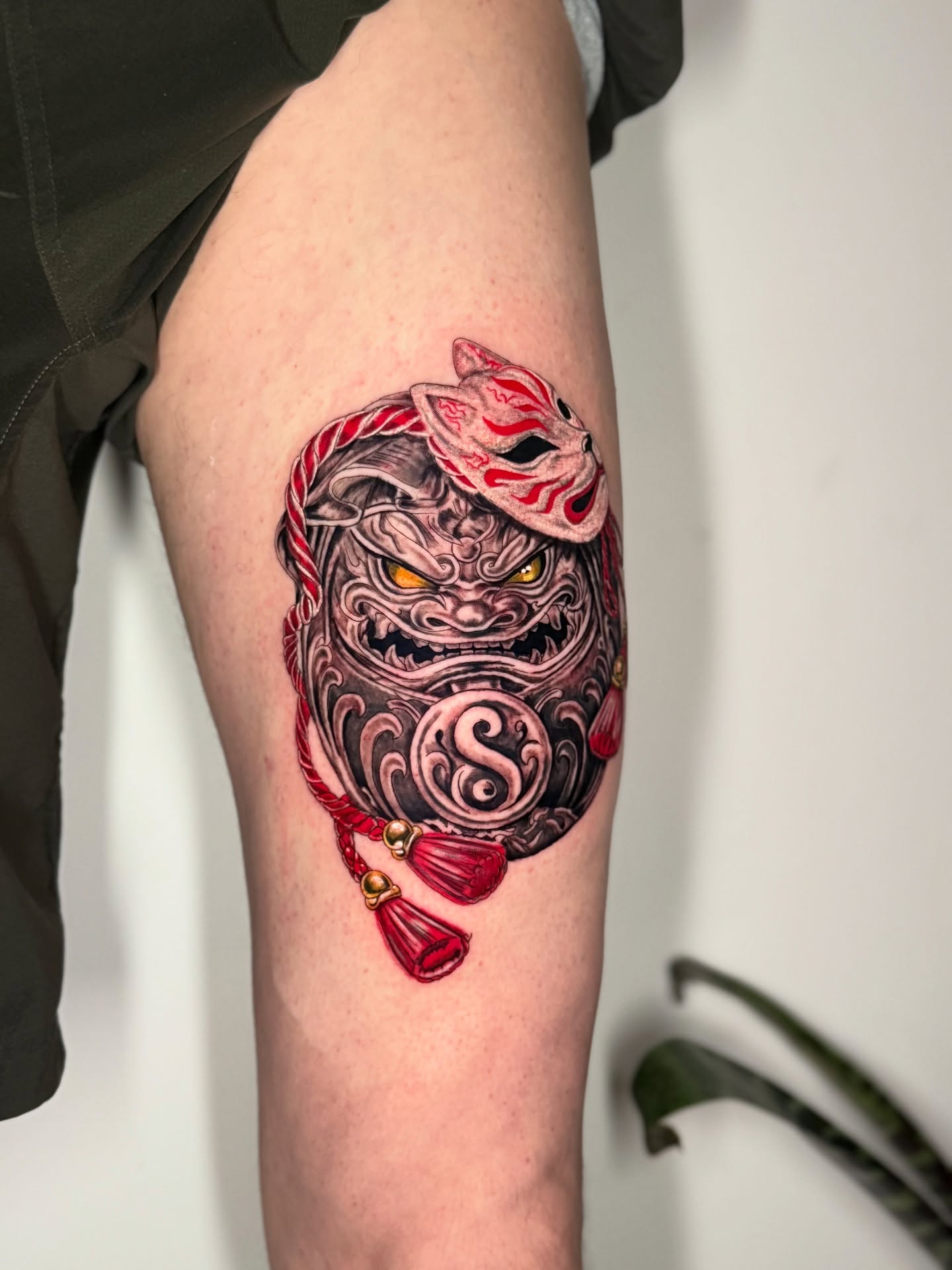 Lion mask japanese irezumi tattoo on the thigh by The Tattoo Plug