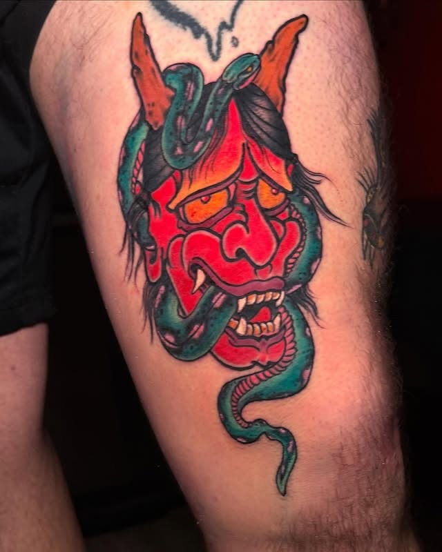 Demon mask with snake American traditional tattoo on the forearm by Edward Choat