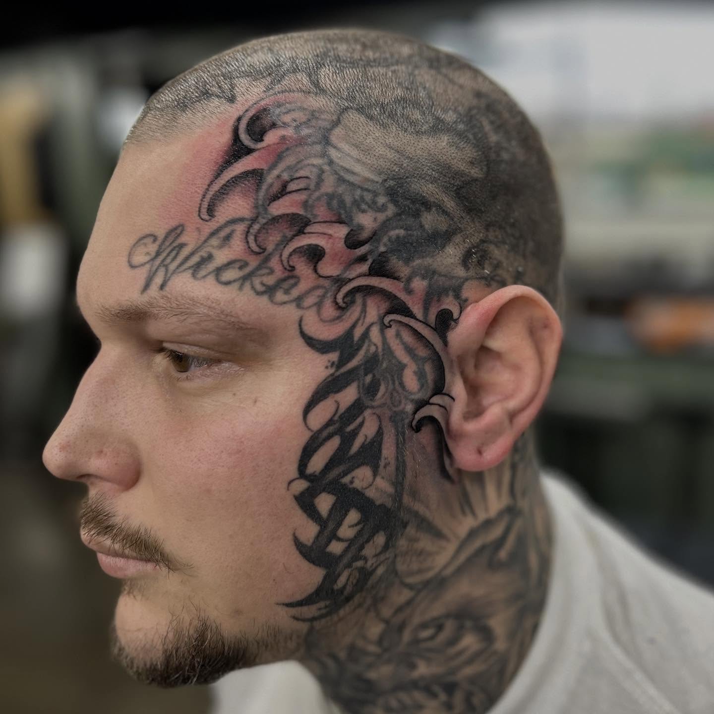 Wicked black and grey tattoo on the head by Dylan O'Quin