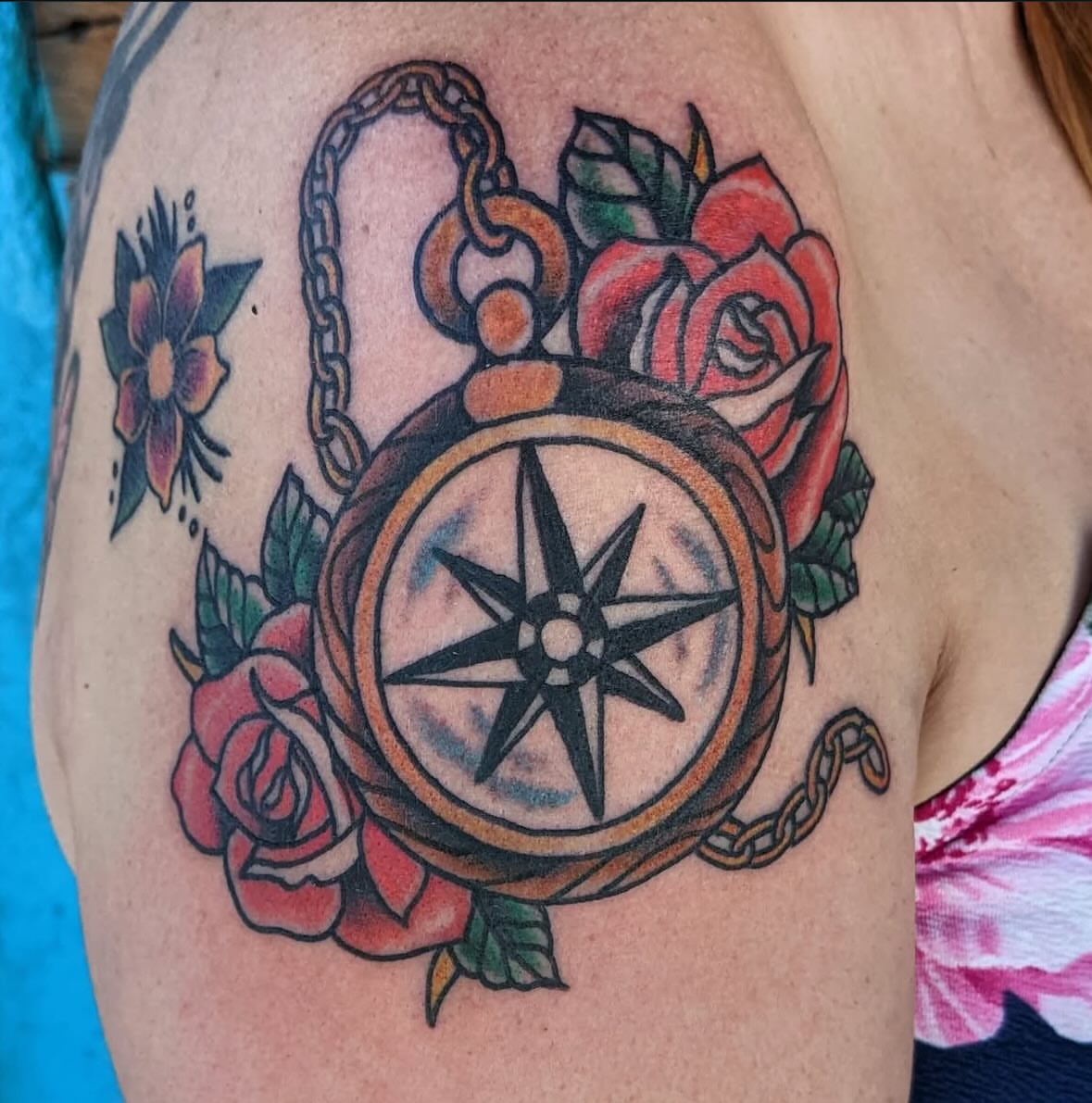 Compass and roses American traditional tattoo on the shoulder by Columbus tattoo artist