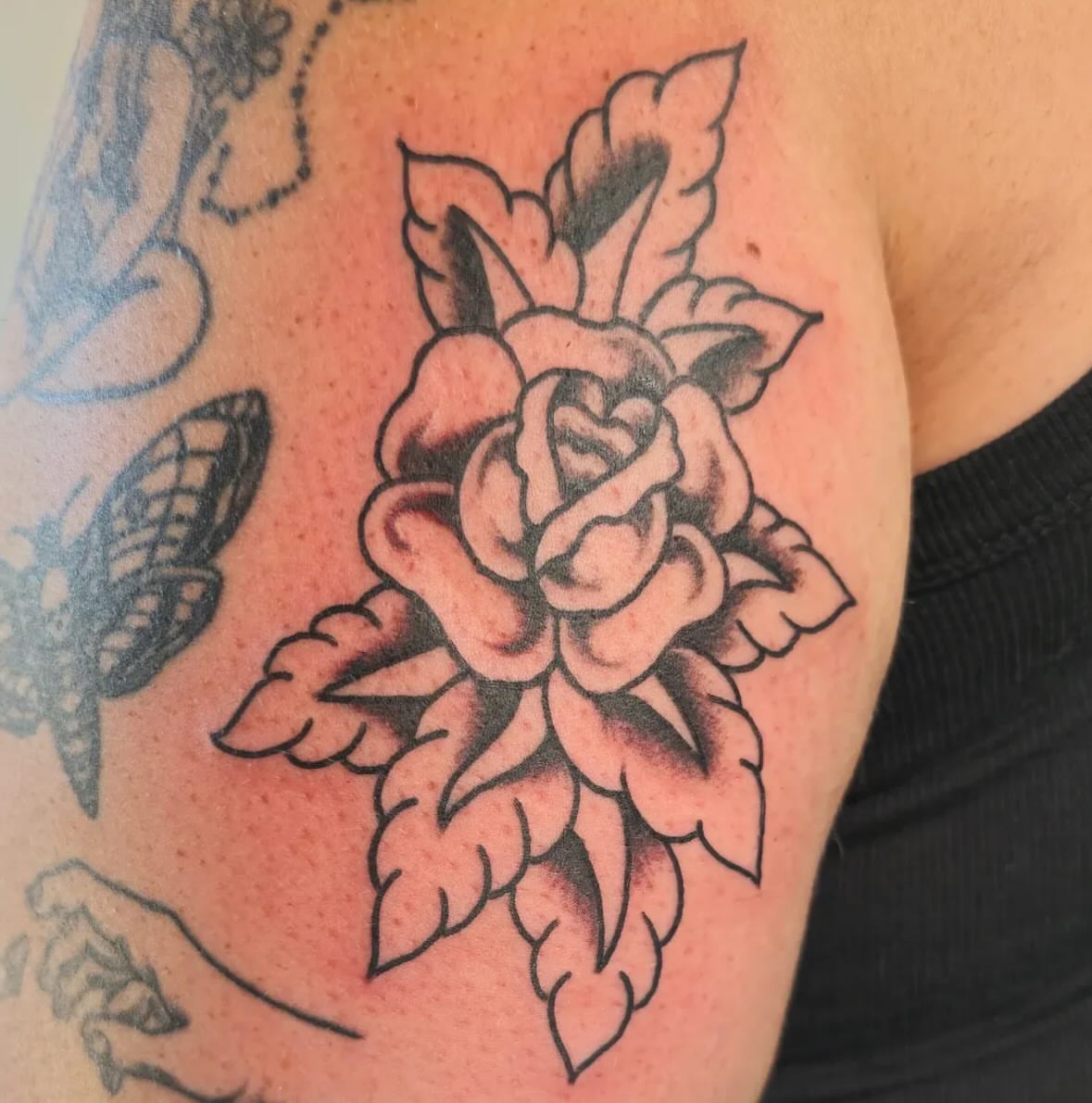 Rose American traditional tattoo on the shoulder by Columbus tattoo artist