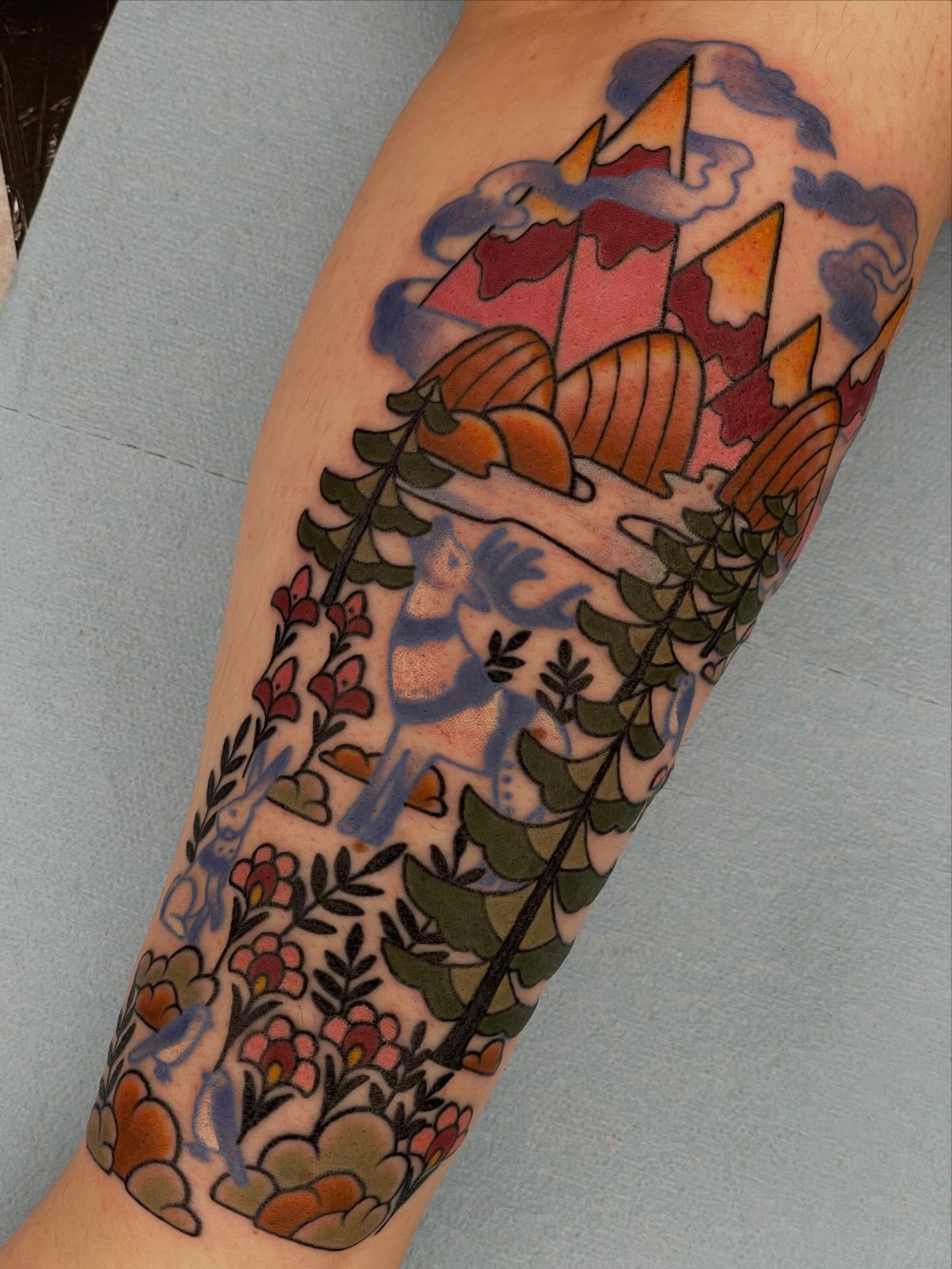 Mountainscape with flora American traditional tattoo on the forearm by Beeker, Bellingham, Washington