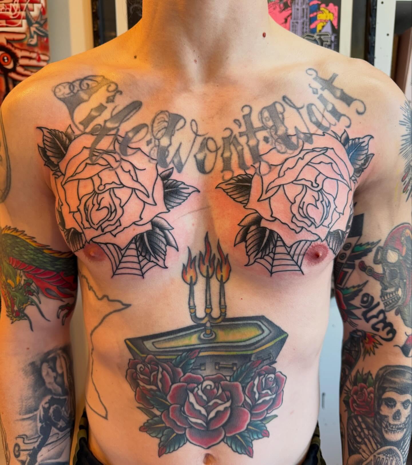 Roses and coffin American traditional tattoo on the chest by Mike Kepper