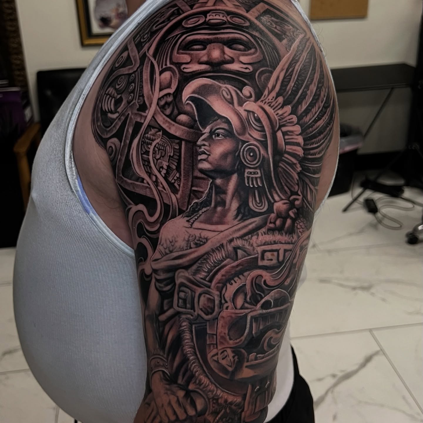 Ancient warrior realism tattoo on the upper arm by Flames, Cerritos, California
