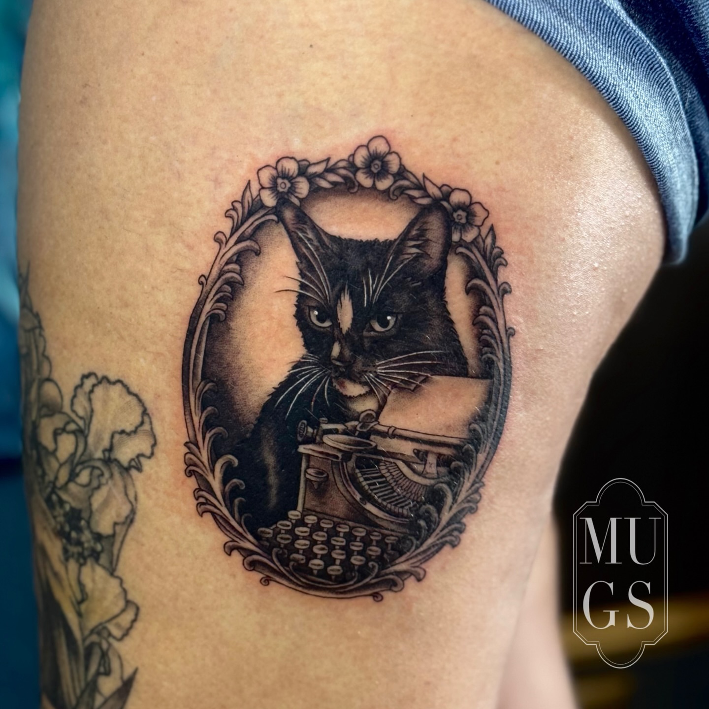 Black cat realism tattoo on the thigh by Emily Andreozzi