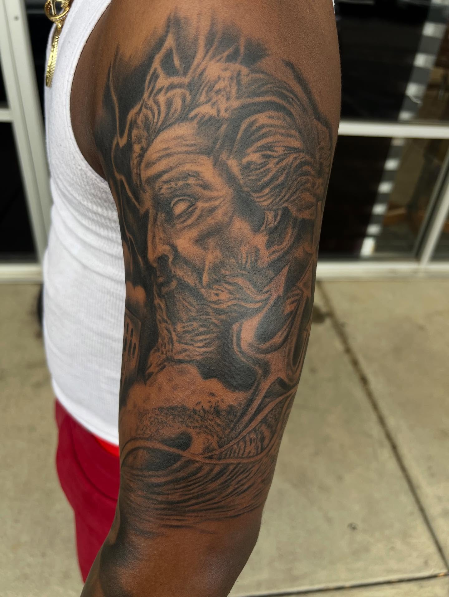 Man's face realism tattoo on the forearm by Dany