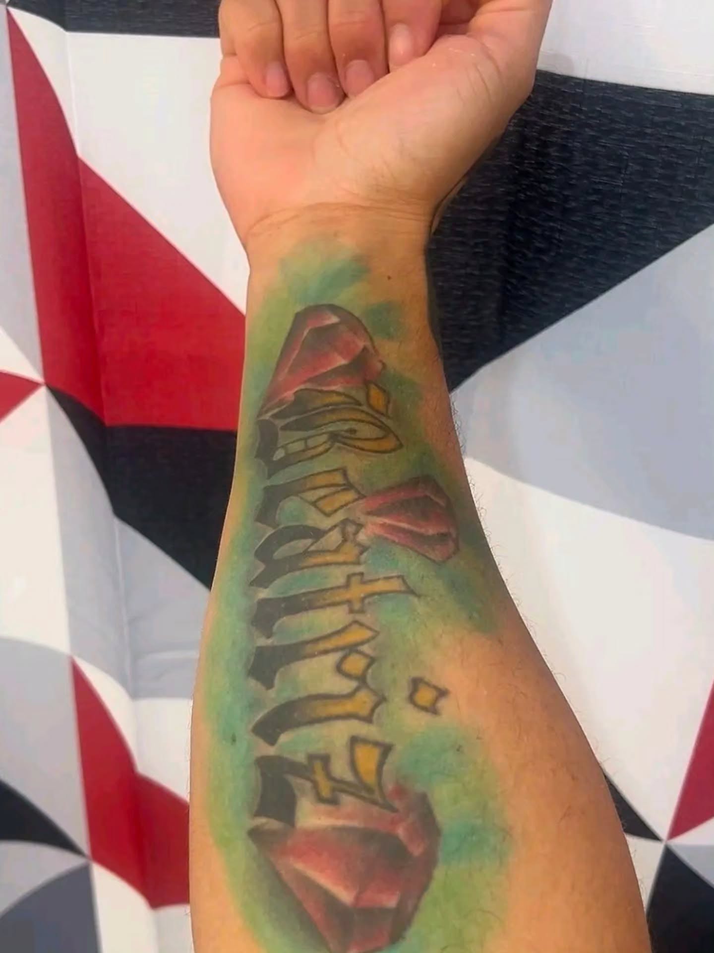 Graffiti-style text tattoo on the forearm by 𝐍𝐄𝐗'𝐒 𝐈𝐍𝐊 🇨🇺, Tampa