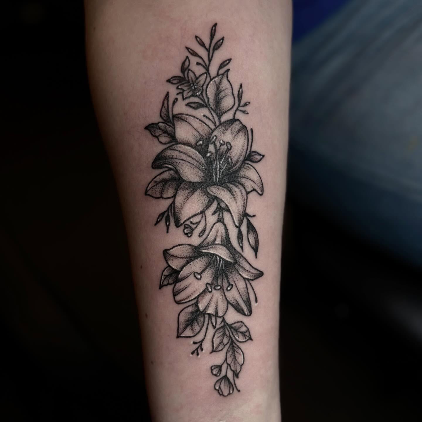 Lily flowers black and grey tattoo on the forearm by ππ©π’π΅ππ«π‘π―π ππ¬π«π’π°