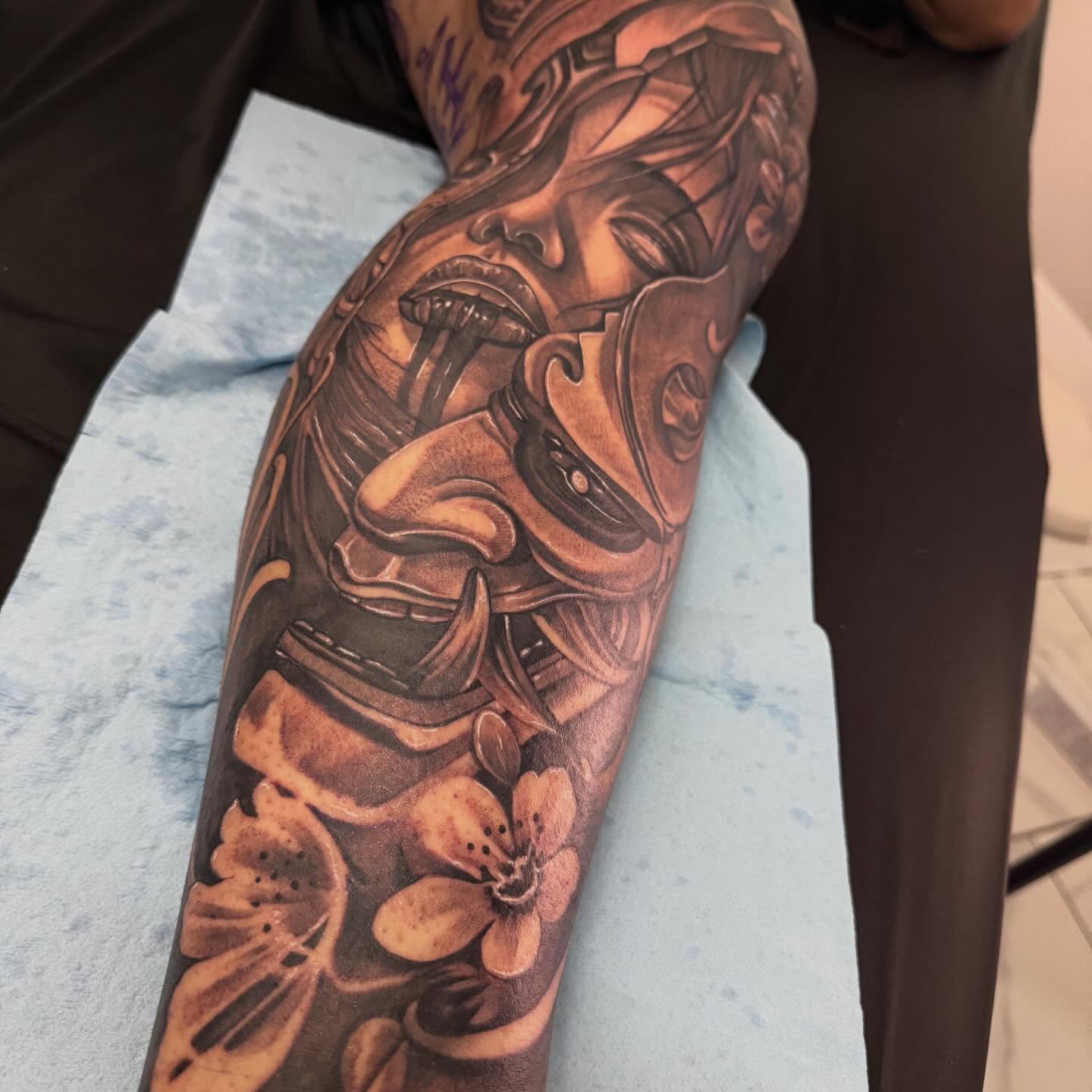 Cyborg woman with flowers realism tattoo on the forearm by Adrian gonzalez...