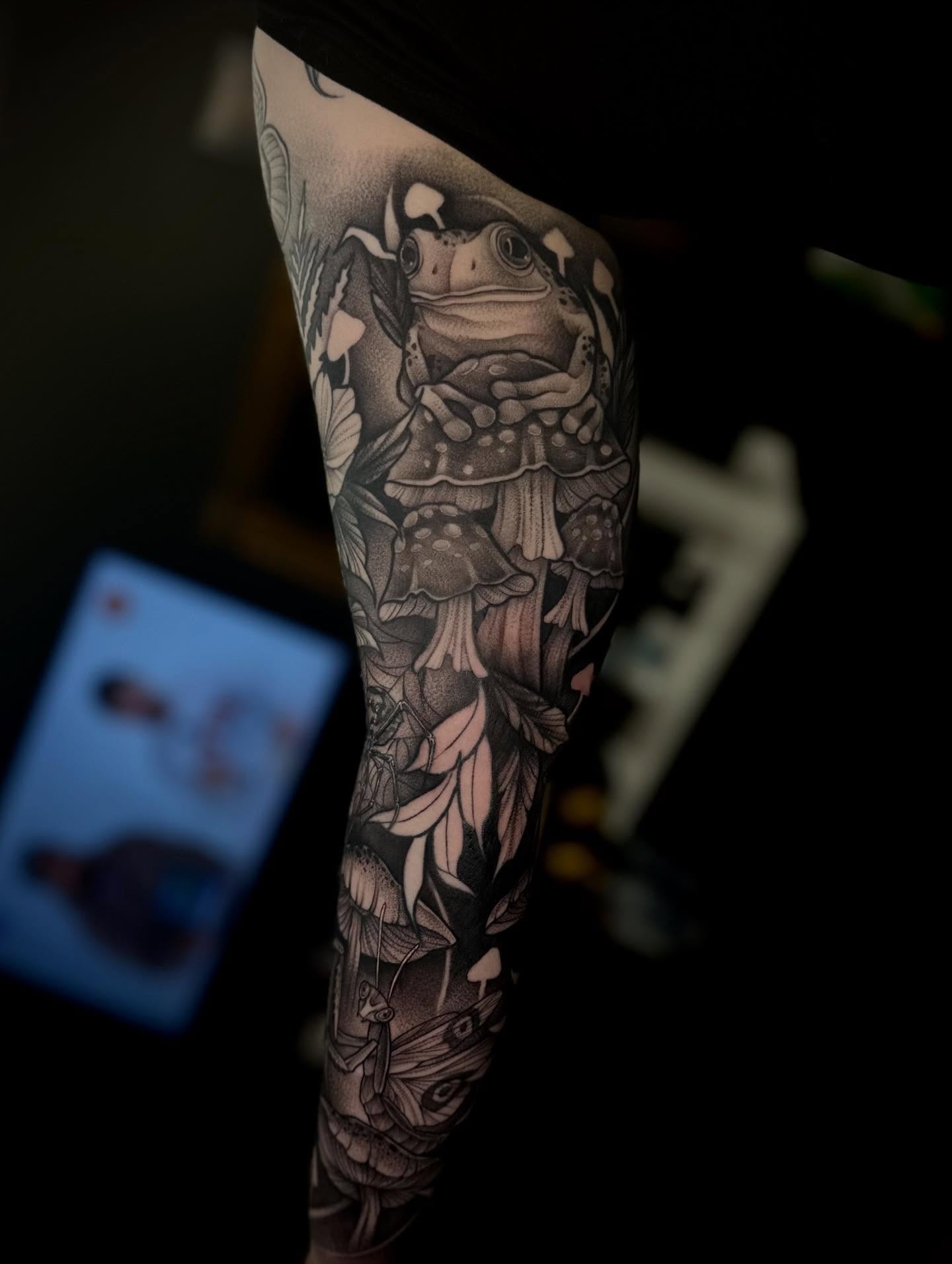 Frog and mushrooms realism tattoo on the forearm by Madison Orchard Tattoos