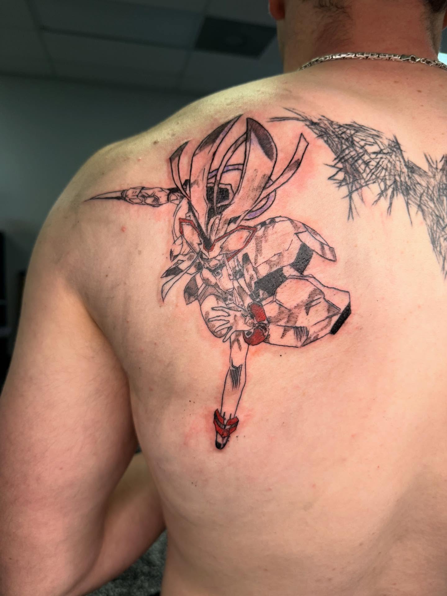 Anime character anime tattoo on the back by Tattoos by Santos