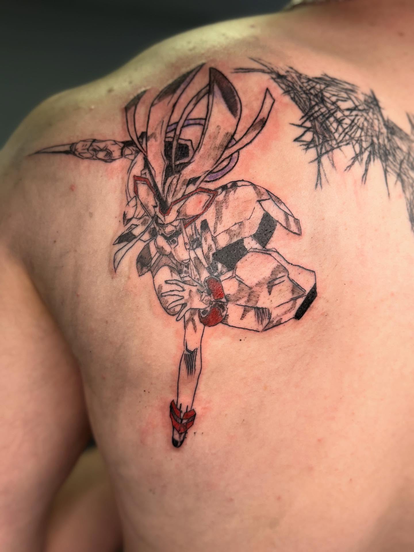 Mecha anime tattoo on the shoulder by Tattoos by Santos